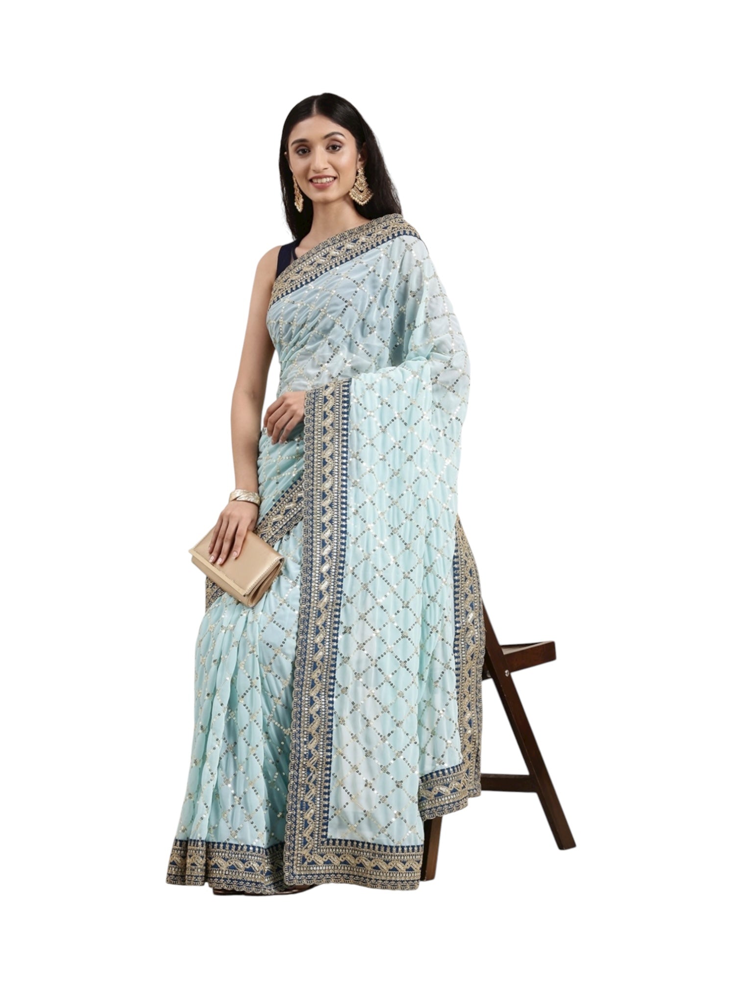Elegant beige Georgette saree by Saree Ghor Charlotte, traditional Indian cultural wear for women with intricate drape and design.