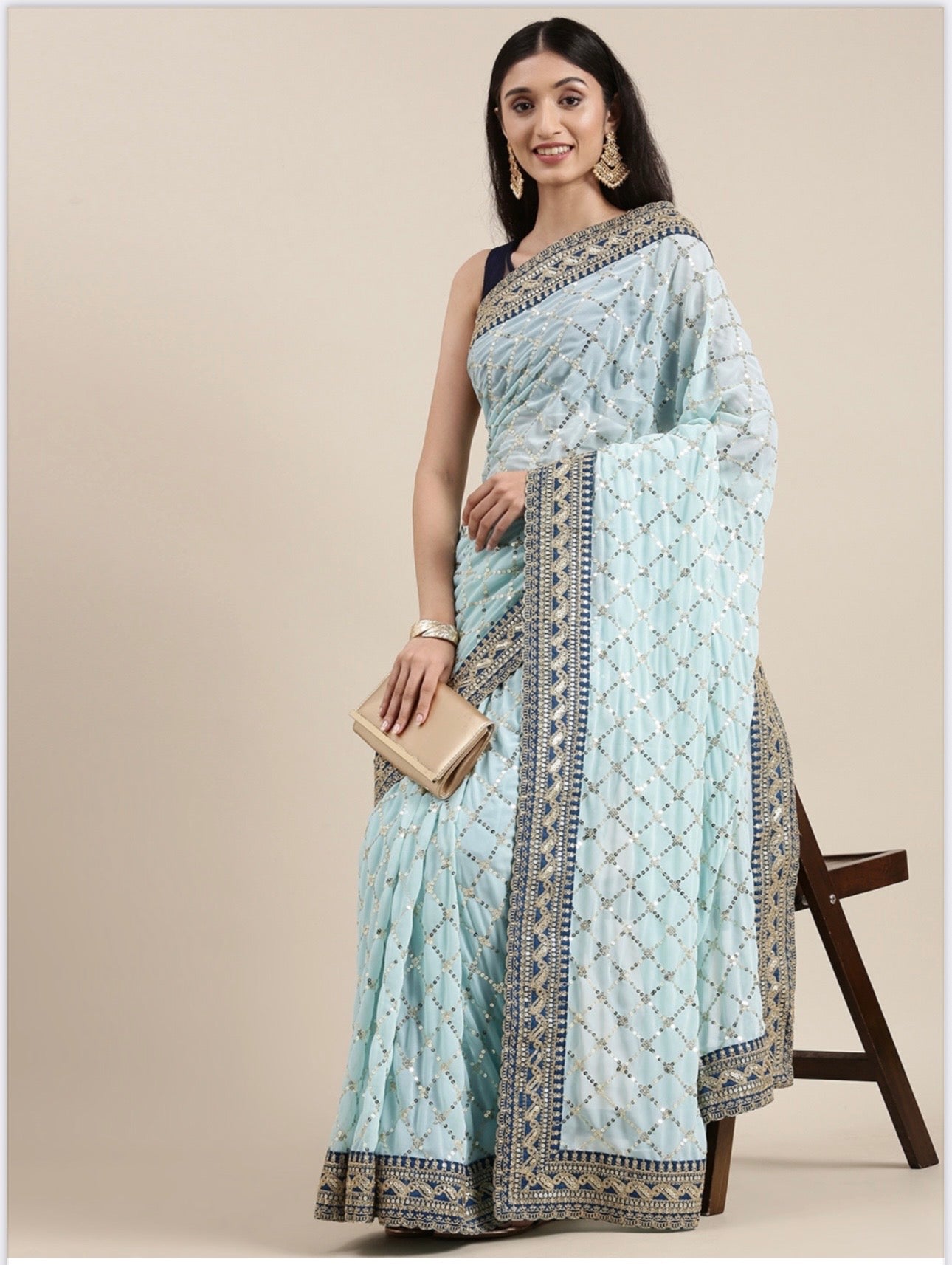Traditional Georgette saree for women by Saree Ghor Charlotte, showcasing elegant drape and intricate cultural design.