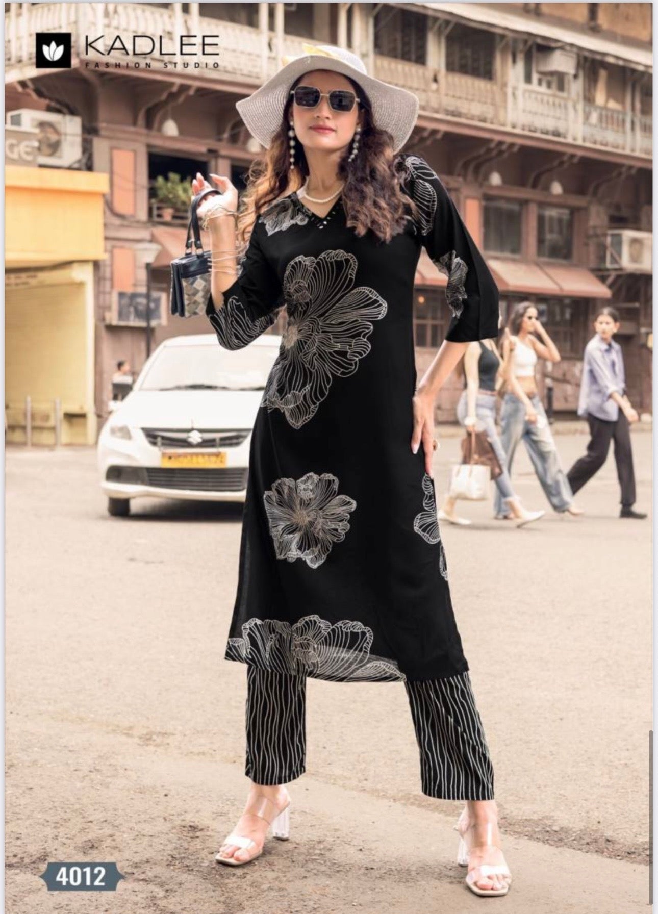 Rayon print traditional two-piece kurti set for women featuring colorful cultural salwar kameez from Saree Ghor Charlotte.
