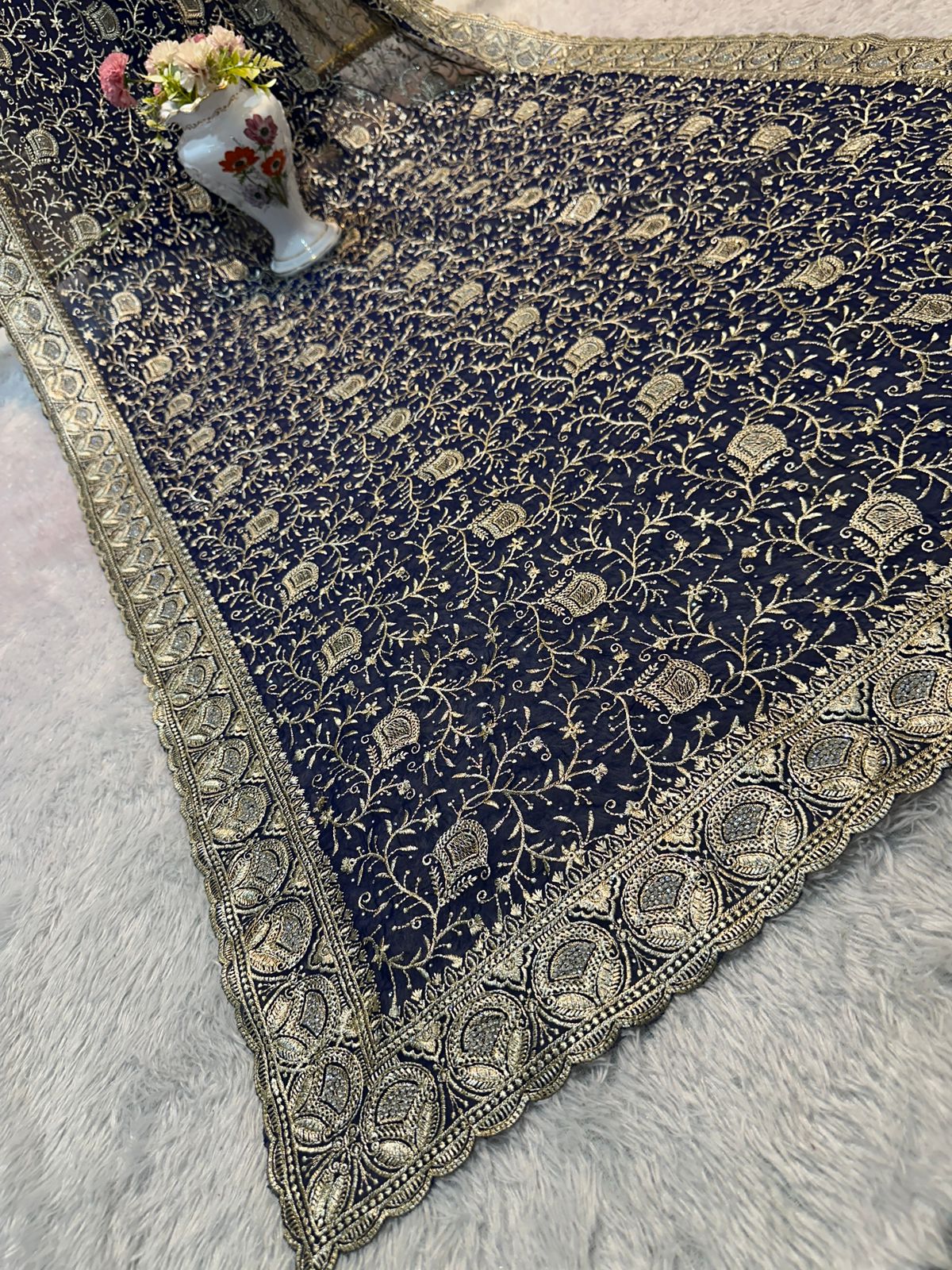 Elegant traditional saree for women by Saree Ghor Charlotte, featuring vibrant fabric and intricate draping style.