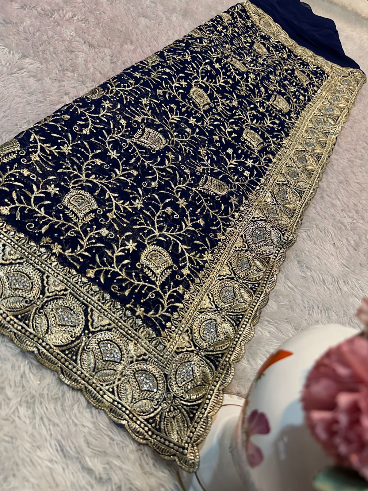 Traditional Saree for women by Saree Ghor Charlotte, showcasing vibrant fabric and intricate draping details.