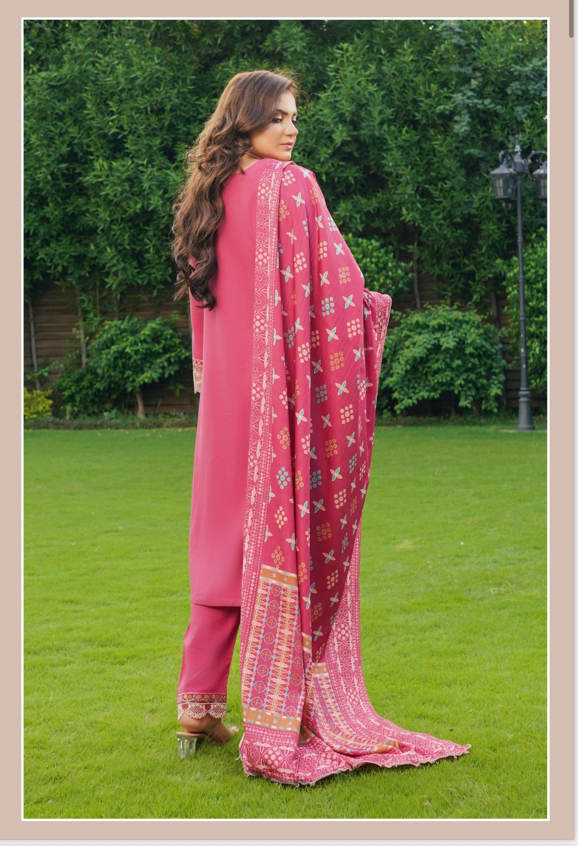 Traditional Pakistani Salwar Kameez for women, featuring colorful embroidery and vibrant fabric from Saree Ghor Charlotte.