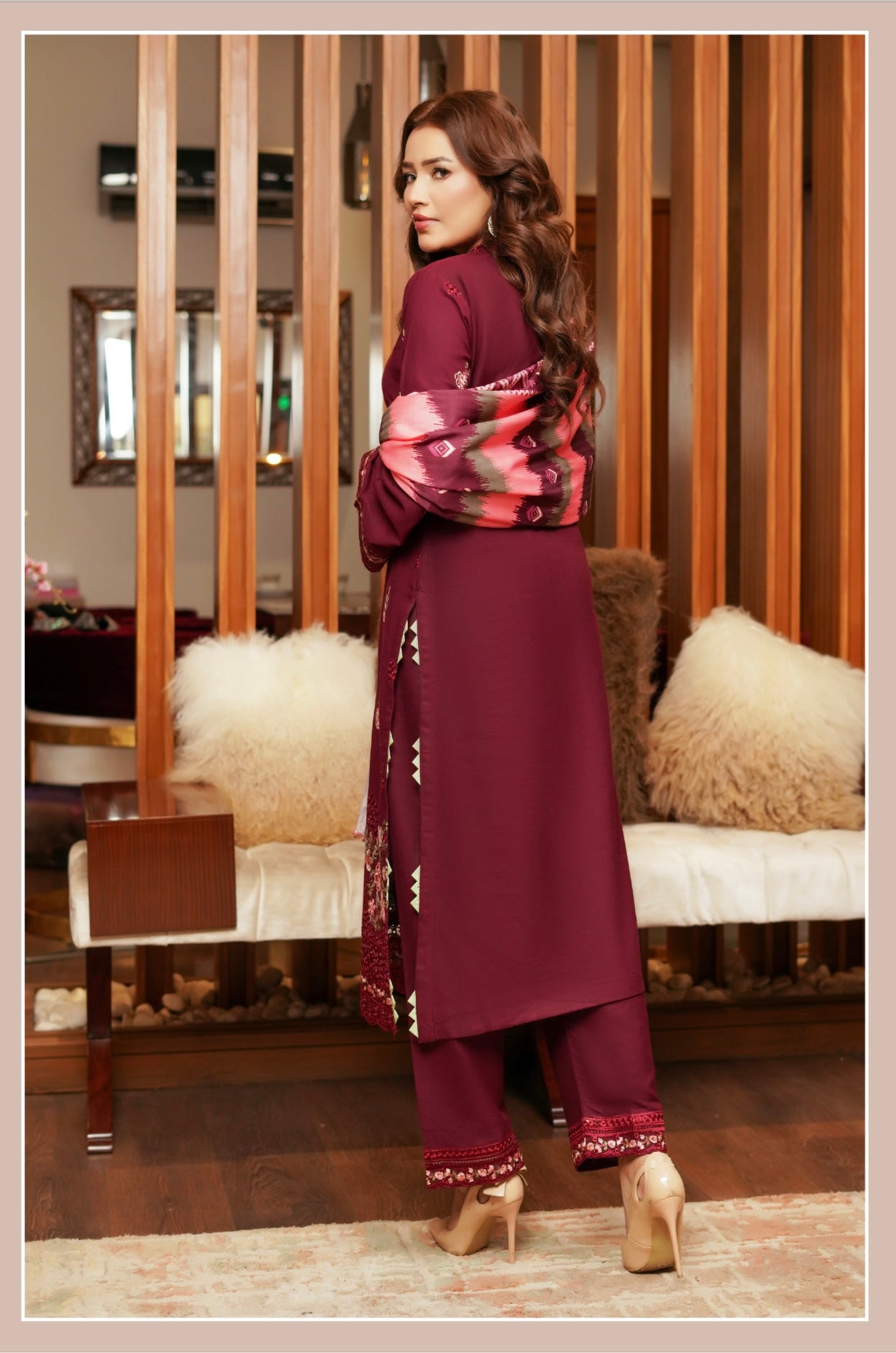 Traditional Pakistani Salwar Kameez for women in vibrant fabric, featuring intricate embroidery and a flowing silhouette.