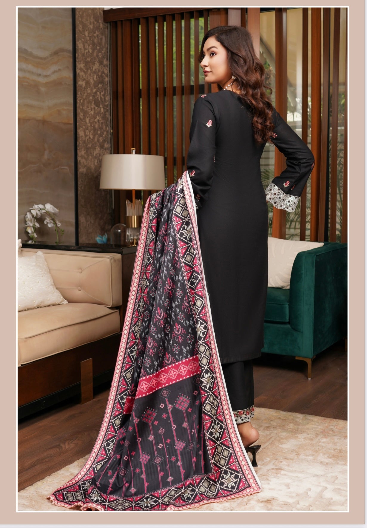 Traditional Pakistani Salwar Kameez for women, featuring vibrant fabric and intricate embroidery, from Saree Ghor Charlotte.