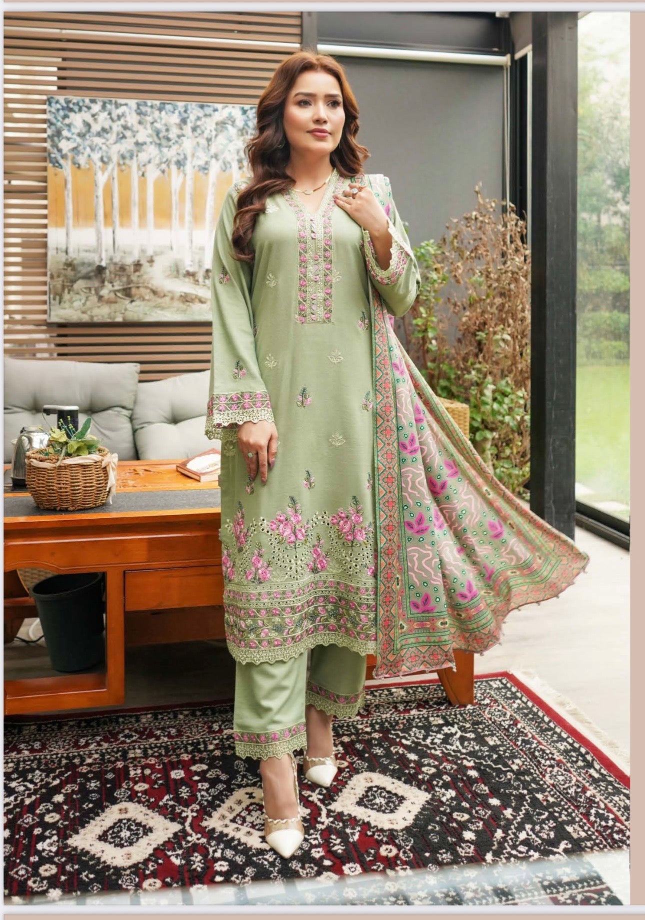 Traditional Pakistani Salwar Kameez for women by Saree Ghor Charlotte, featuring colorful embroidery and elegant cultural design.