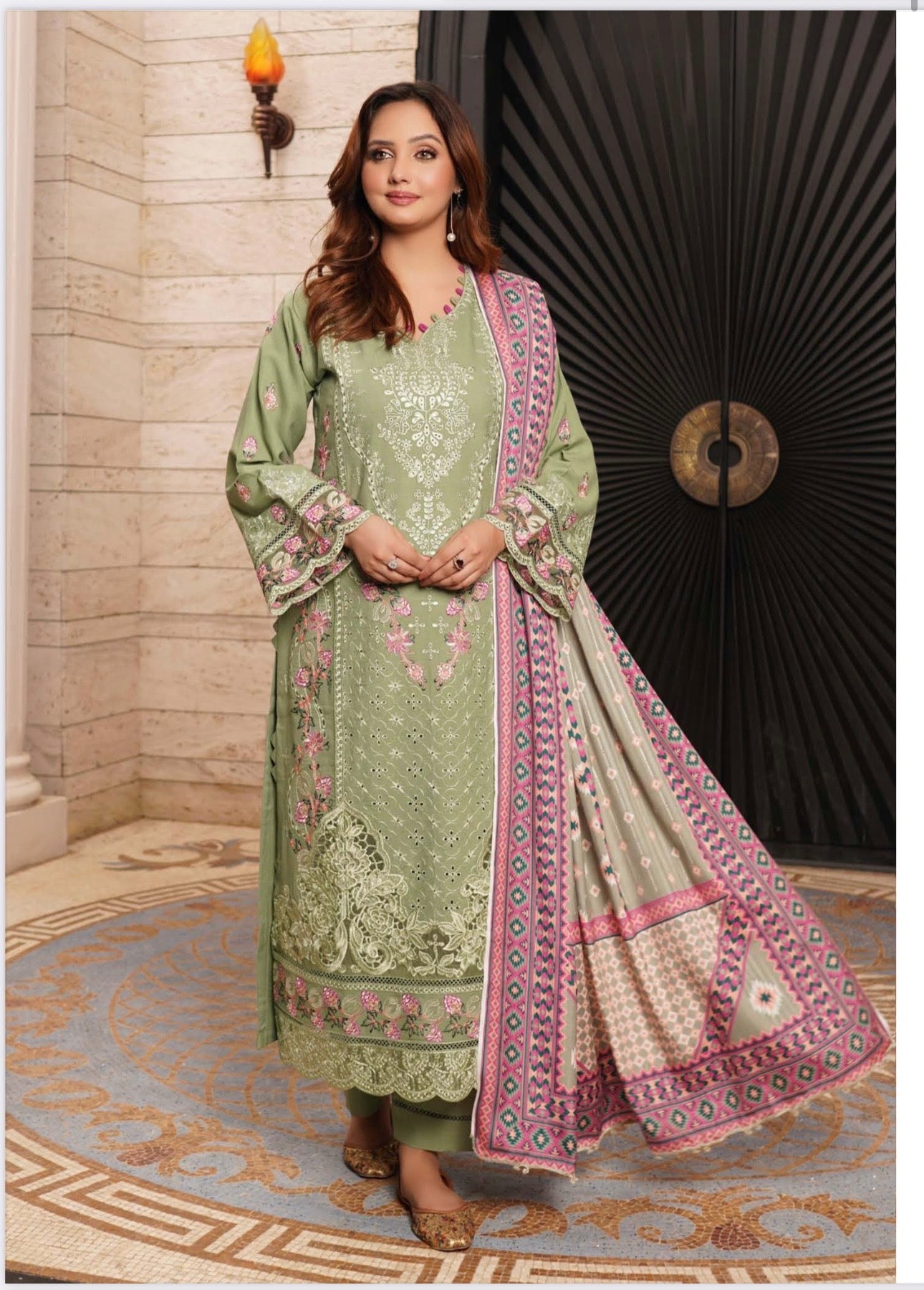 Traditional Pakistani Salwar Kameez for women featuring intricate embroidery and vibrant fabric, by Saree Ghor Charlotte.