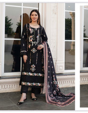 Traditional Pakistani Salwar Kameez for women, colorful cultural wear by Saree Ghor Charlotte, detailed fabric and embroidery visible.