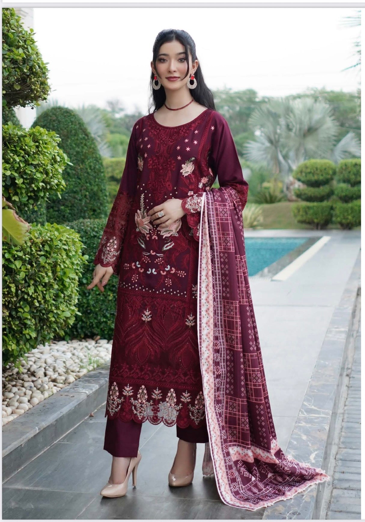 Traditional Pakistani Salwar Kameez for women, featuring intricate embroidery and vibrant fabric in a cultural wear style.