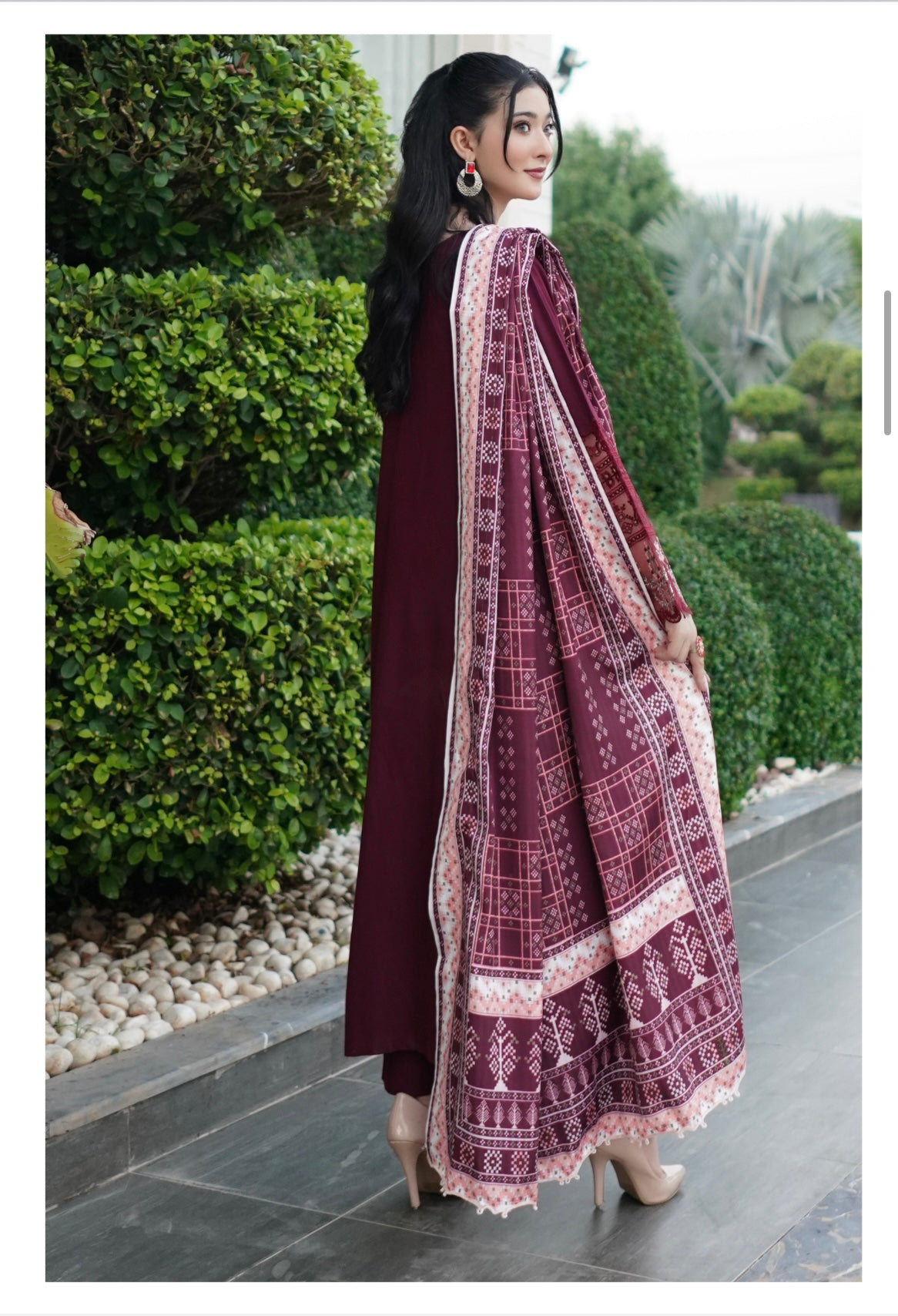 Traditional Pakistani Salwar Kameez for women, featuring intricate embroidery and vibrant colors, by Saree Ghor Charlotte.