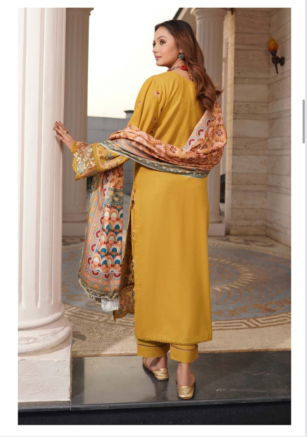 Traditional Pakistani Salwar Kameez for women featuring intricate embroidery and vibrant colors, from Saree Ghor Charlotte.