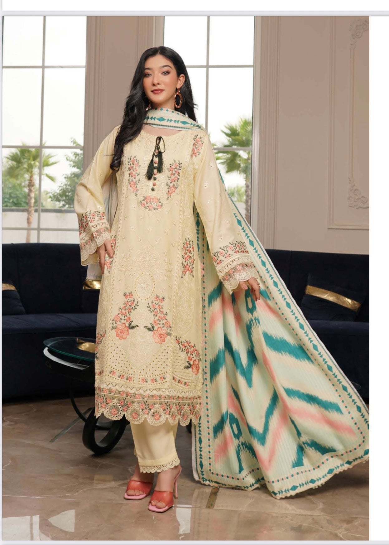 Traditional Pakistani Salwar Kameez for women by Saree Ghor Charlotte, featuring colorful fabric and intricate embroidery.