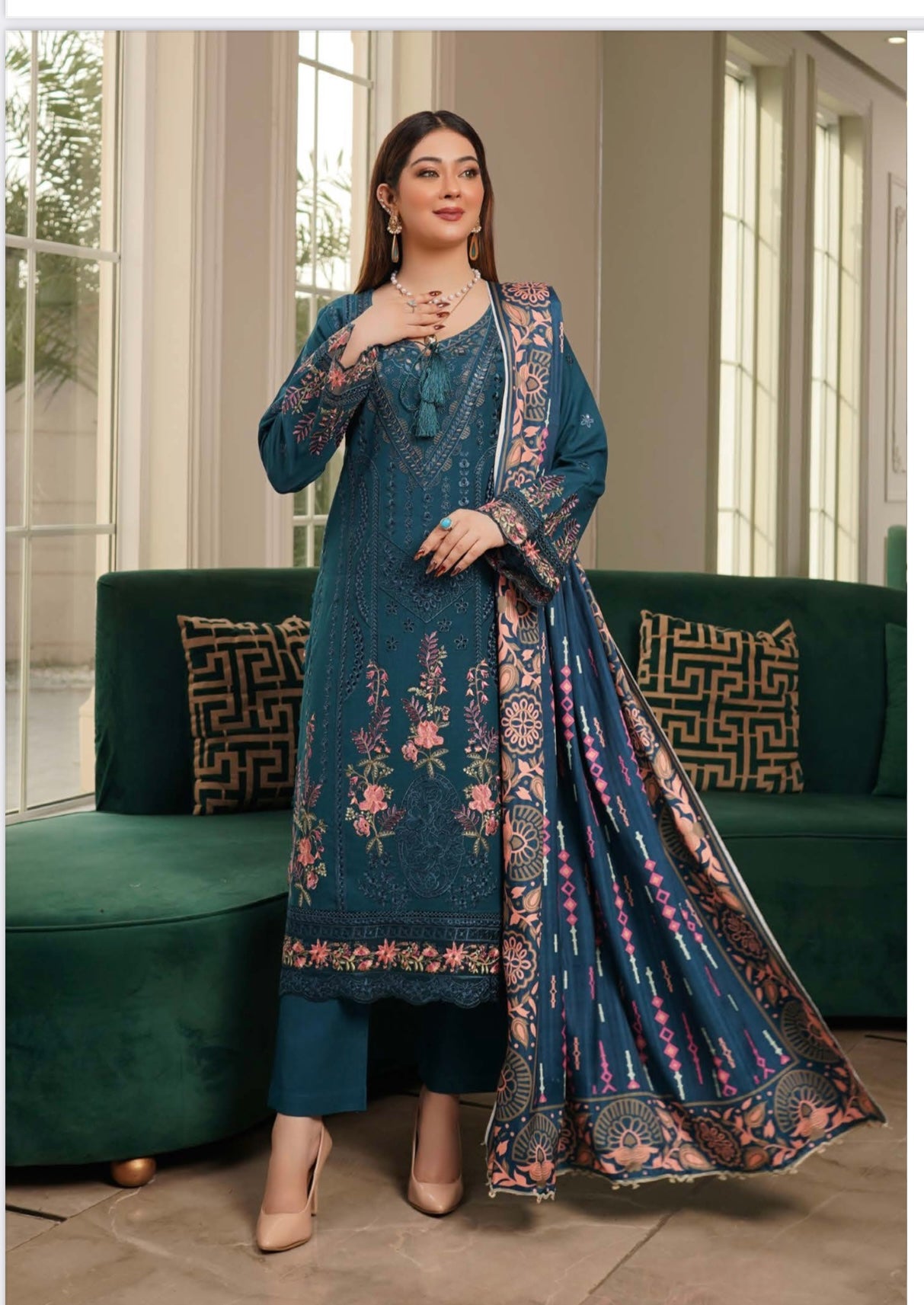Traditional Pakistani Salwar Kameez from Saree Ghor Charlotte, featuring vibrant fabric and intricate embroidery for women's cultural wear.