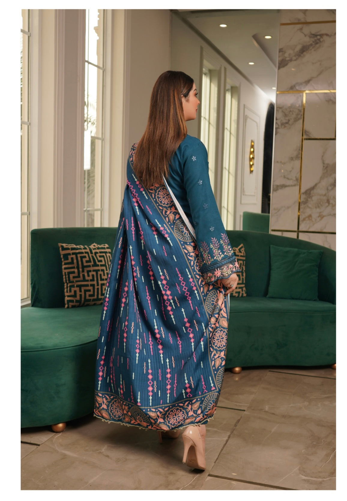 Traditional Pakistani Salwar Kameez for women, featuring intricate embroidery and vibrant fabric from Saree Ghor Charlotte.