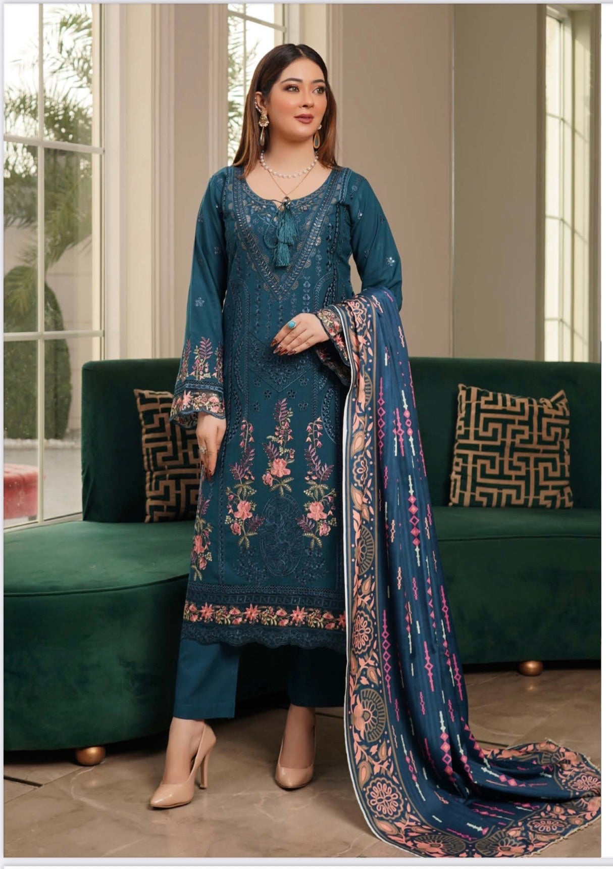 Traditional Pakistani Salwar Kameez for women, featuring vibrant fabric and intricate embroidery, by Saree Ghor Charlotte.