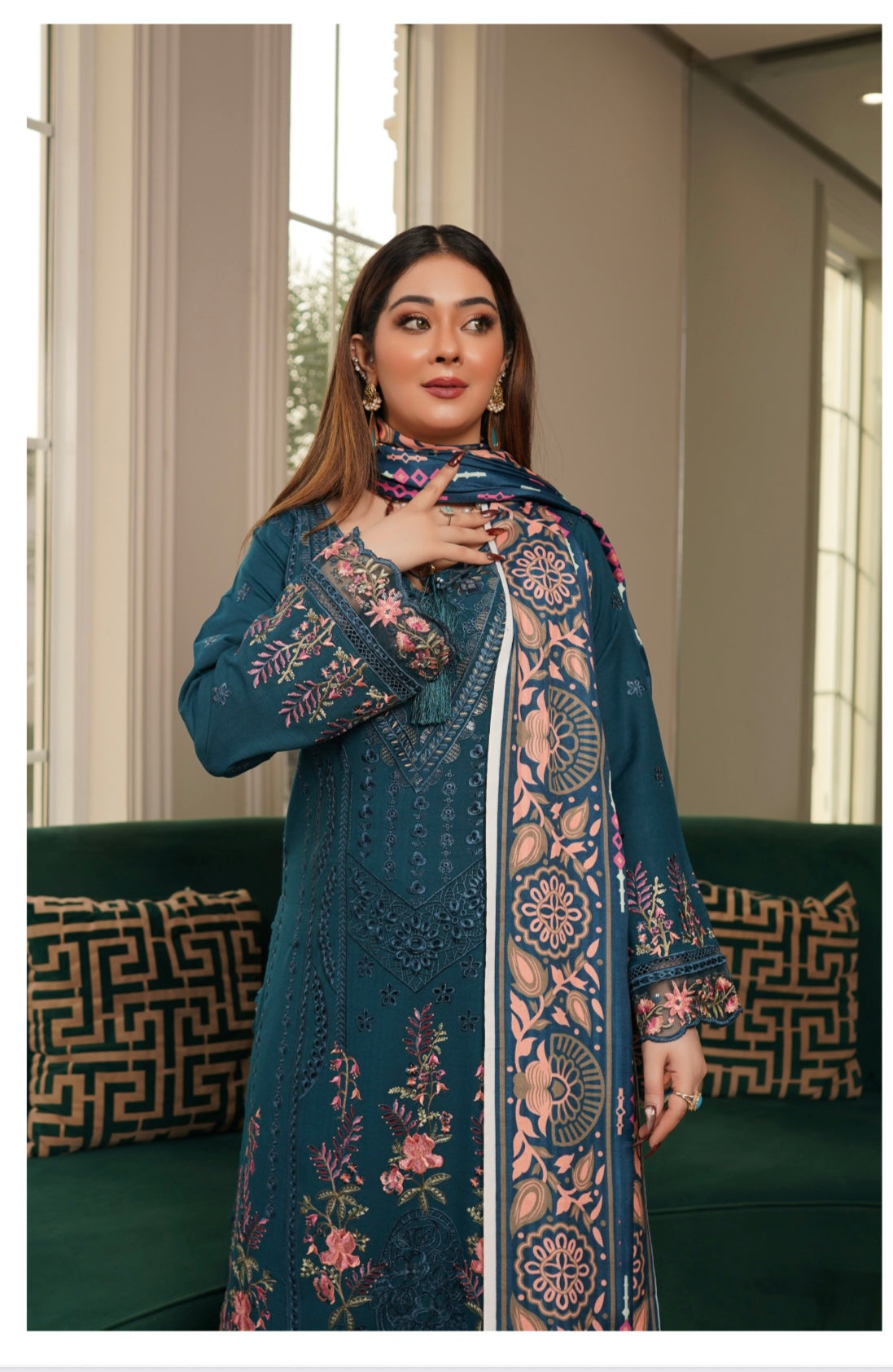 Traditional Pakistani Salwar Kameez for women by Saree Ghor Charlotte, featuring colorful fabric and intricate embroidery.