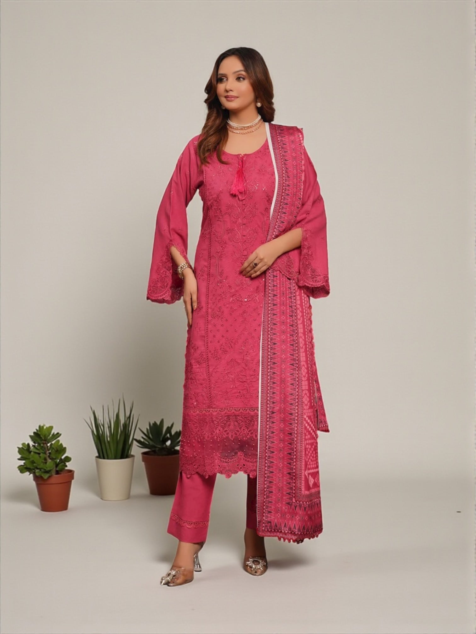 Traditional Pakistani Salwar Kameez for women by Saree Ghor Charlotte, showcasing intricate embroidery and vibrant fabric details.