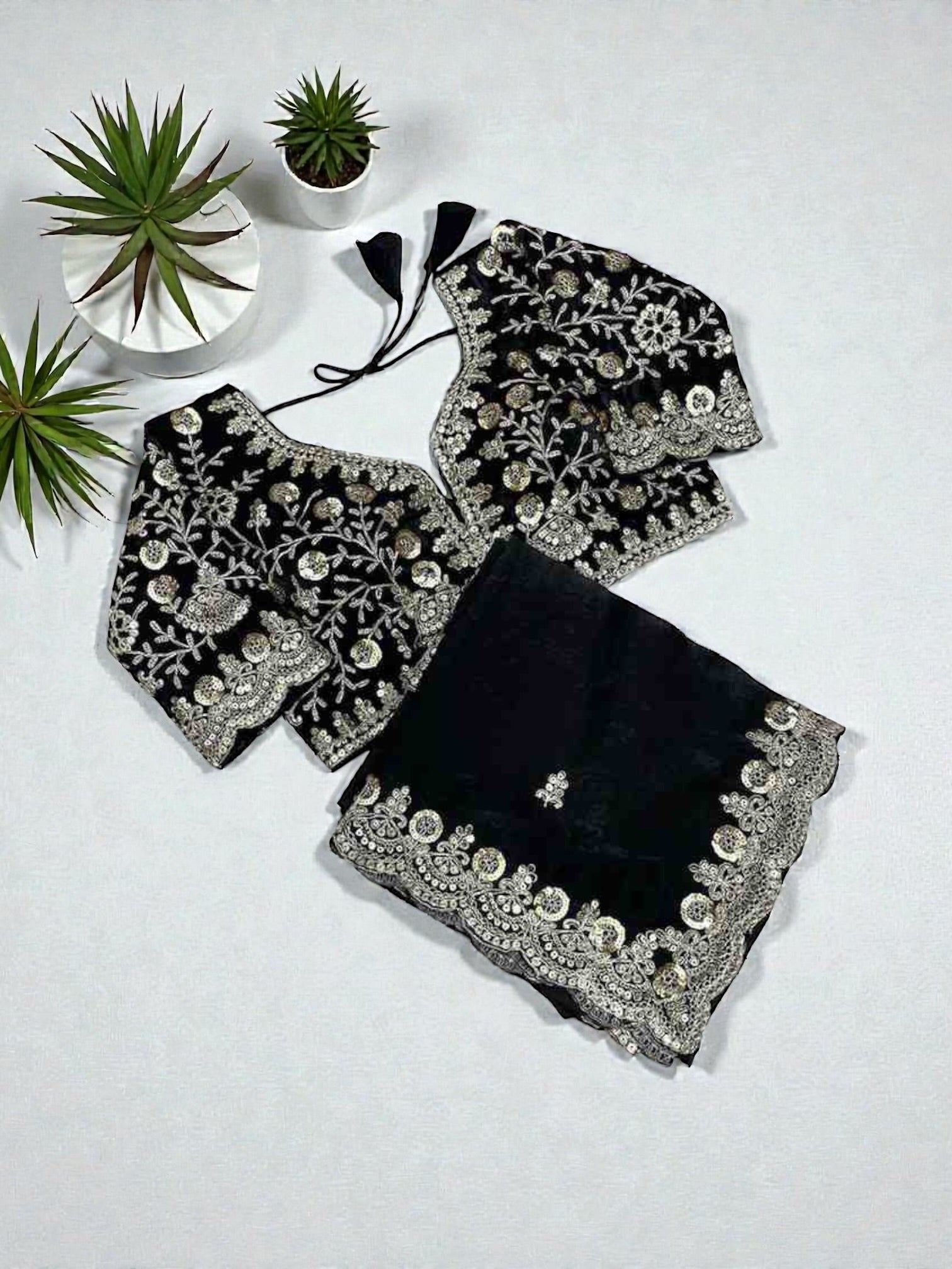 Traditional Saree with ready blouse by Saree Ghor Charlotte, showcasing intricate fabric and elegant drape for cultural wear.