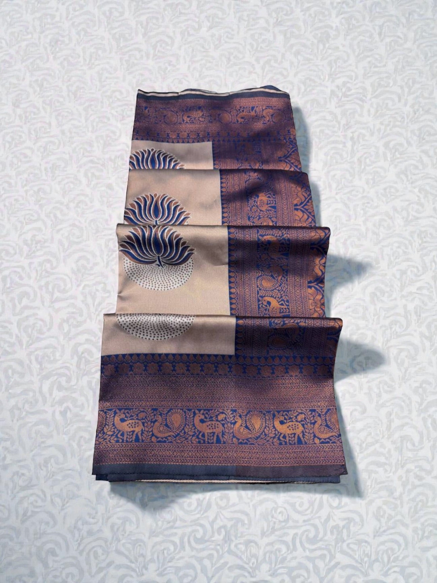 Elegant traditional saree for women by Saree Ghor Charlotte, showcasing vibrant fabric and intricate draping details.