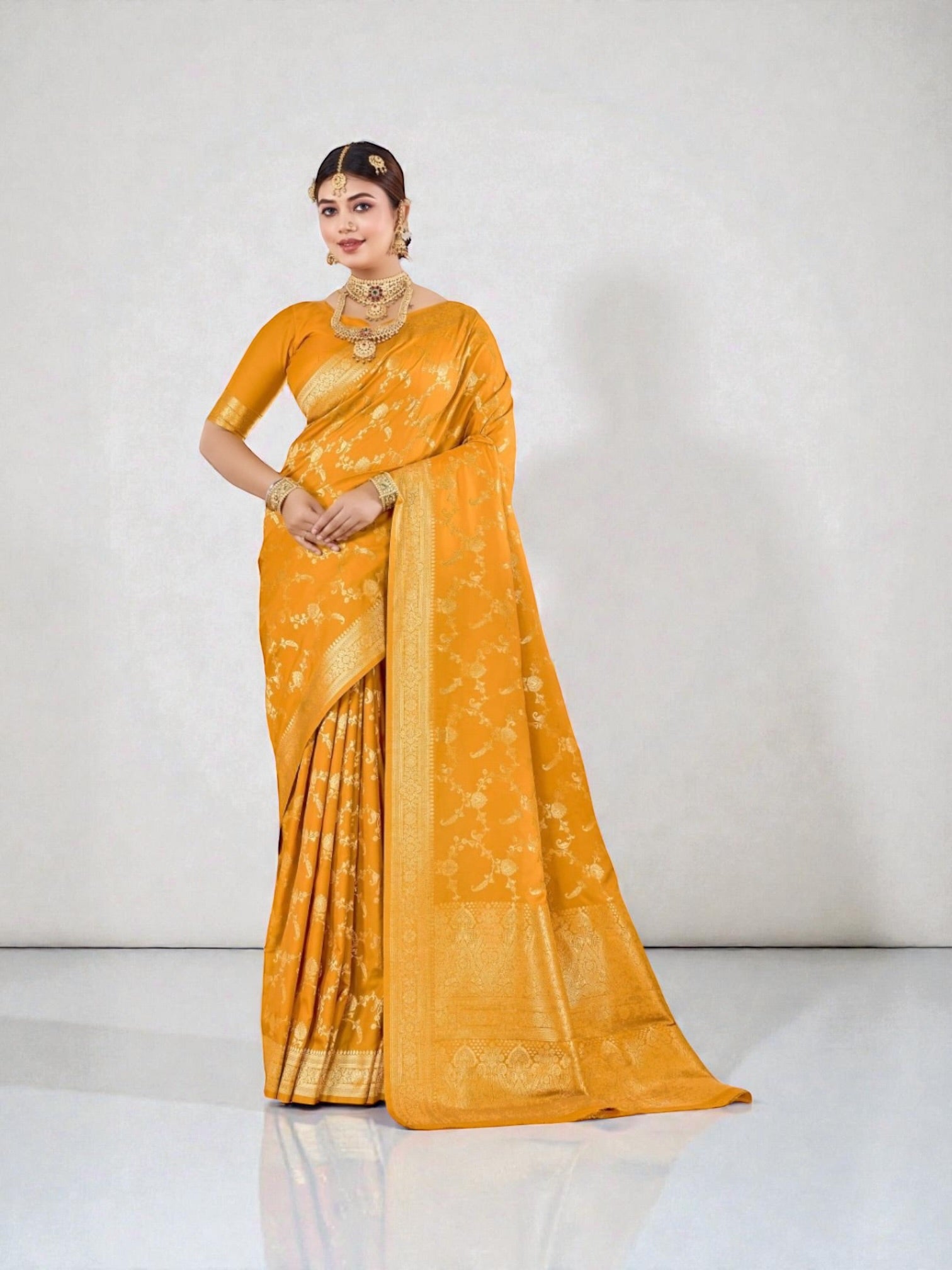 Elegant Katan Silk Saree by Saree Ghor Charlotte, showcasing intricate traditional designs and vibrant cultural style for women.