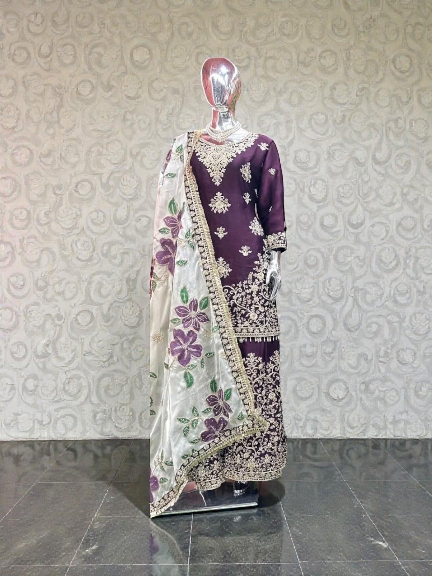 Russian Plazo Dress by Saree Ghor Charlotte, a traditional Salwar Kameez with vibrant patterns worn by women.