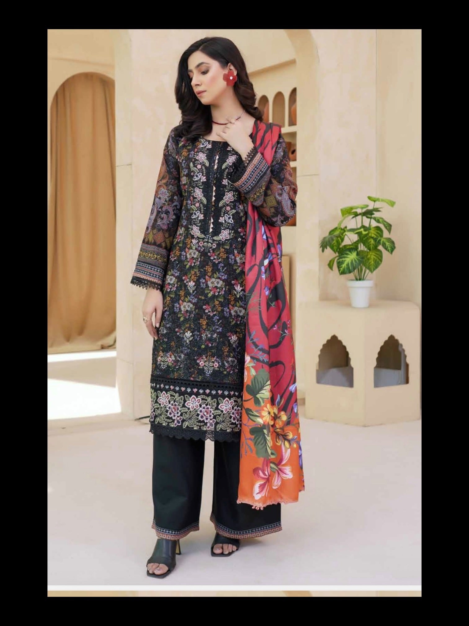 Elegant traditional Pakistani Salwar Kameez for women by Saree Ghor Charlotte, featuring intricate embroidery and vibrant colors.