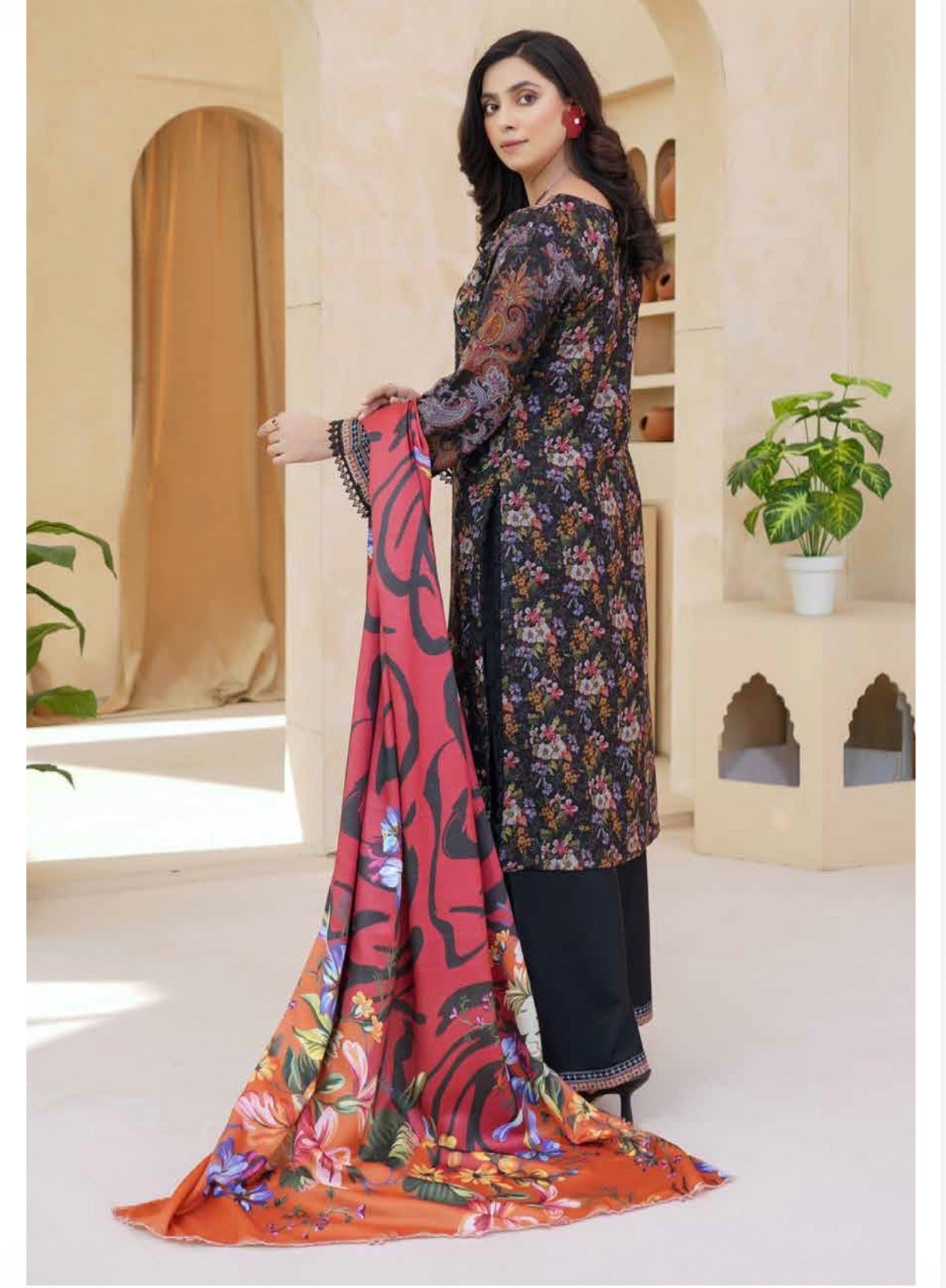 Traditional Pakistani Salwar Kameez for women, featuring vibrant fabric and intricate embroidery, by Saree Ghor Charlotte.