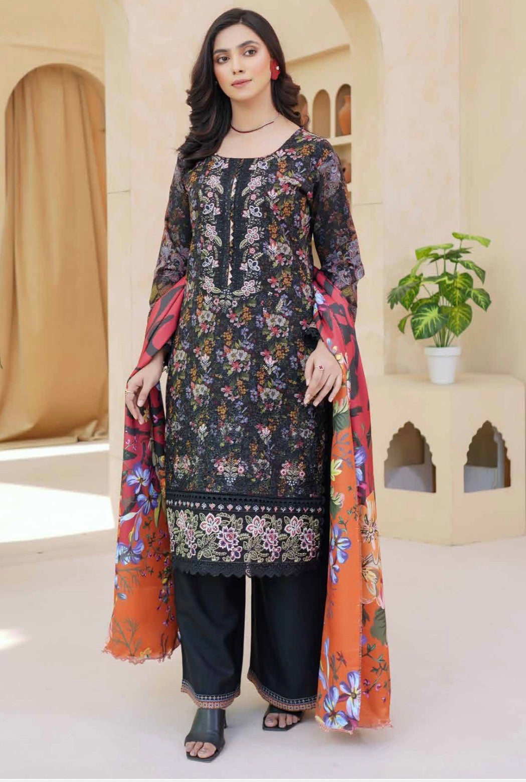 Traditional Pakistani Salwar Kameez for women, colorful cultural attire from Saree Ghor Charlotte, featuring intricate embroidery and vibrant fabric.