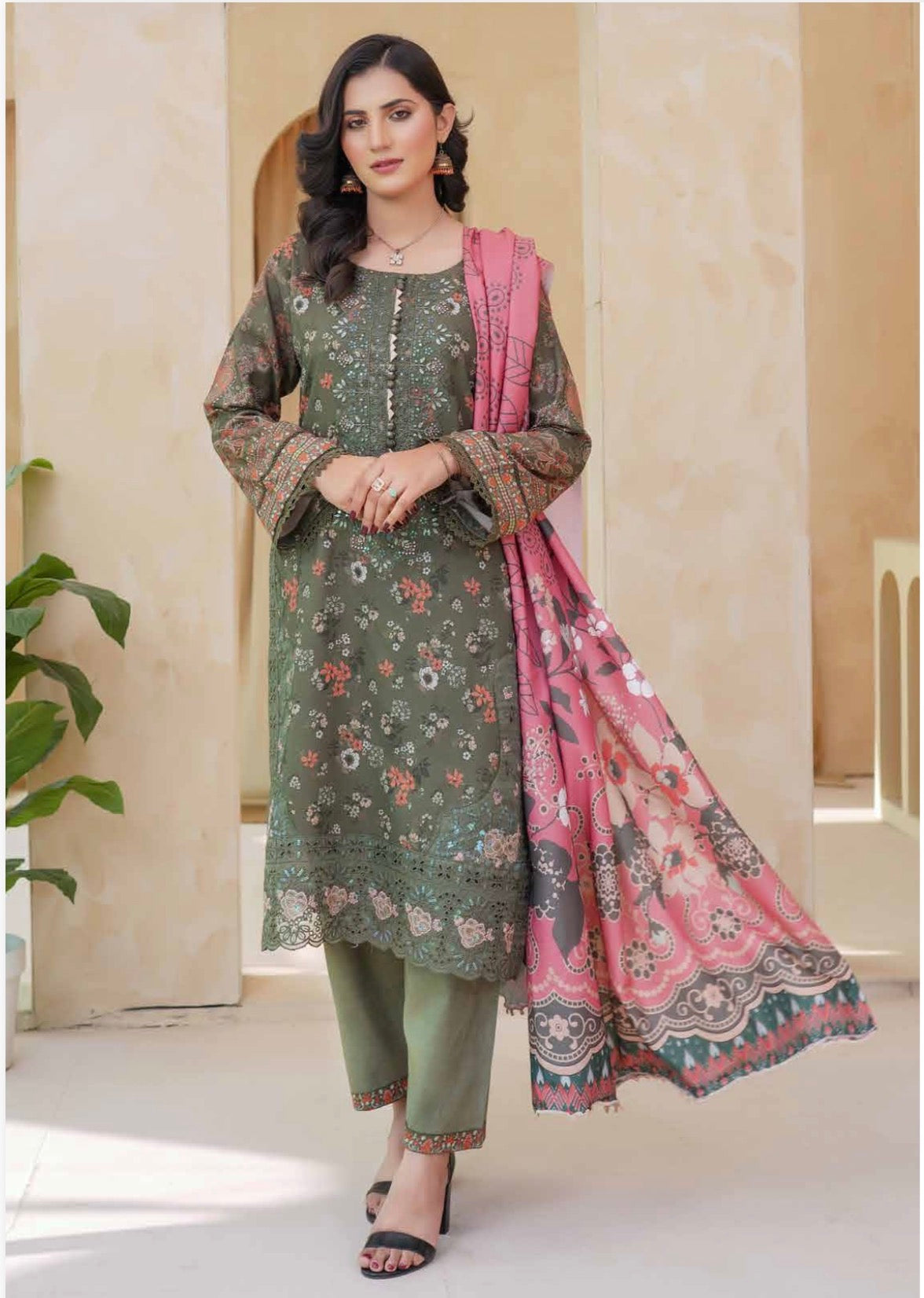 Traditional Pakistani Salwar Kameez by Saree Ghor Charlotte featuring vibrant fabric and intricate embroidery for cultural wear.