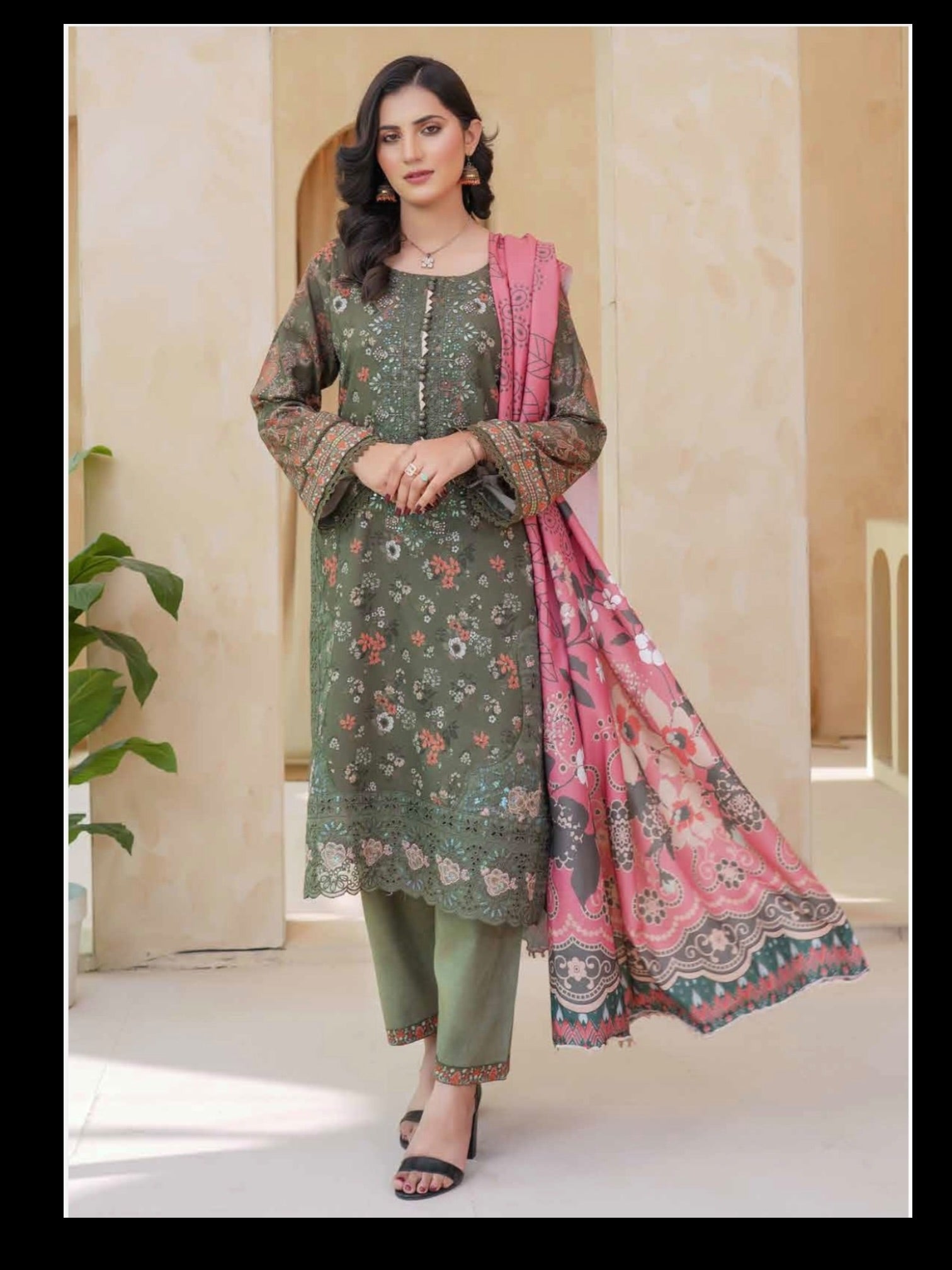 Traditional Pakistani Salwar Kameez for women, featuring vibrant fabric and intricate embroidery from Saree Ghor Charlotte.