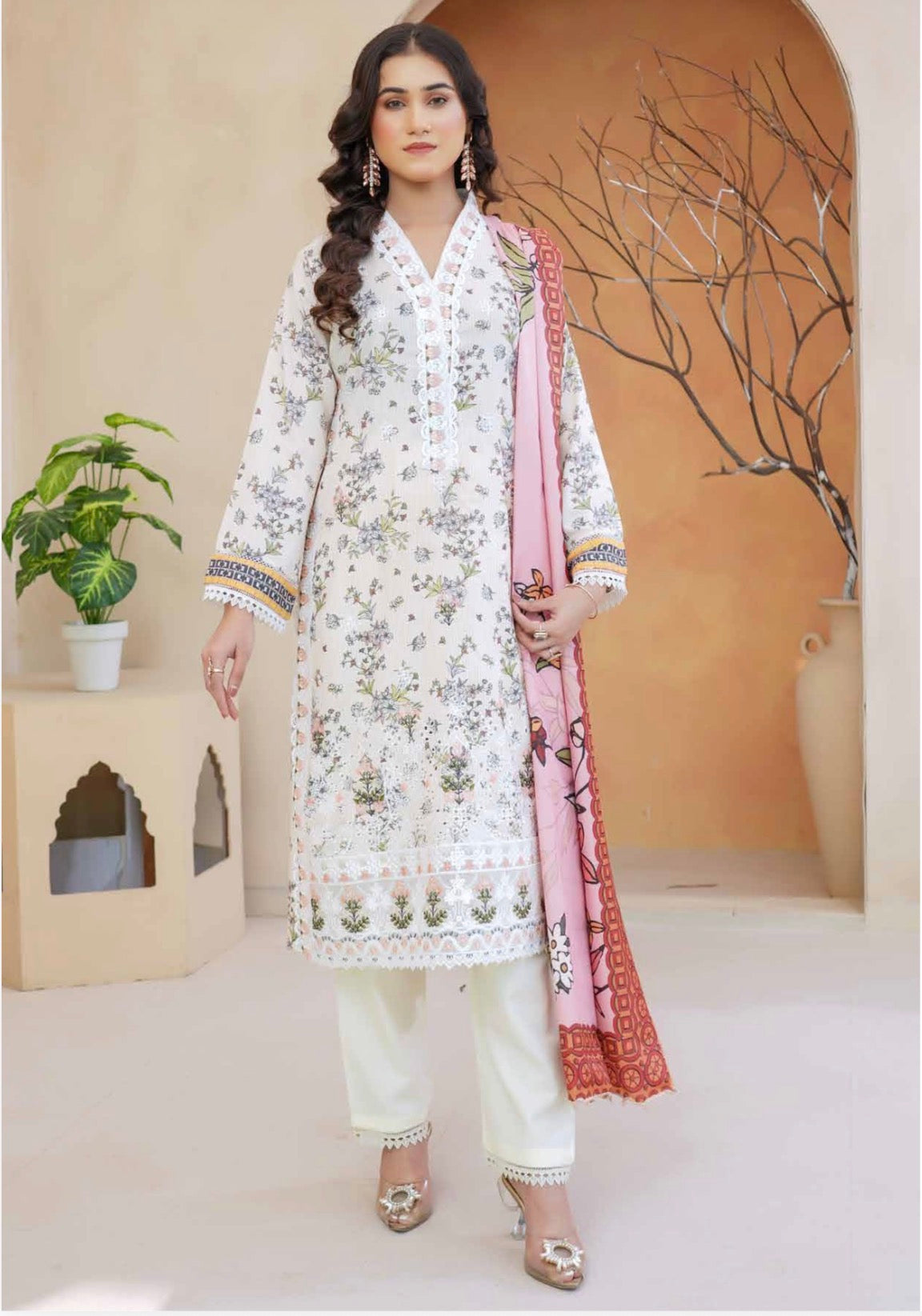 Traditional Pakistani Salwar Kameez for women, featuring intricate embroidery and vibrant colors, from Saree Ghor Charlotte.