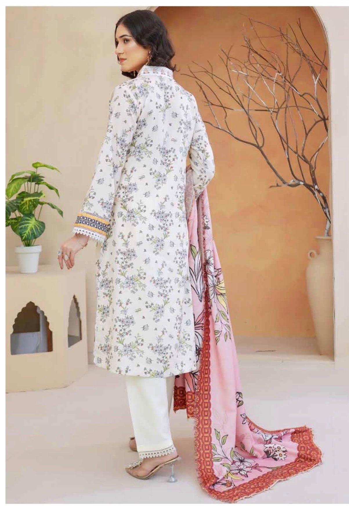 Traditional Pakistani Salwar Kameez for women featuring vibrant embroidery and cultural design by Saree Ghor Charlotte.