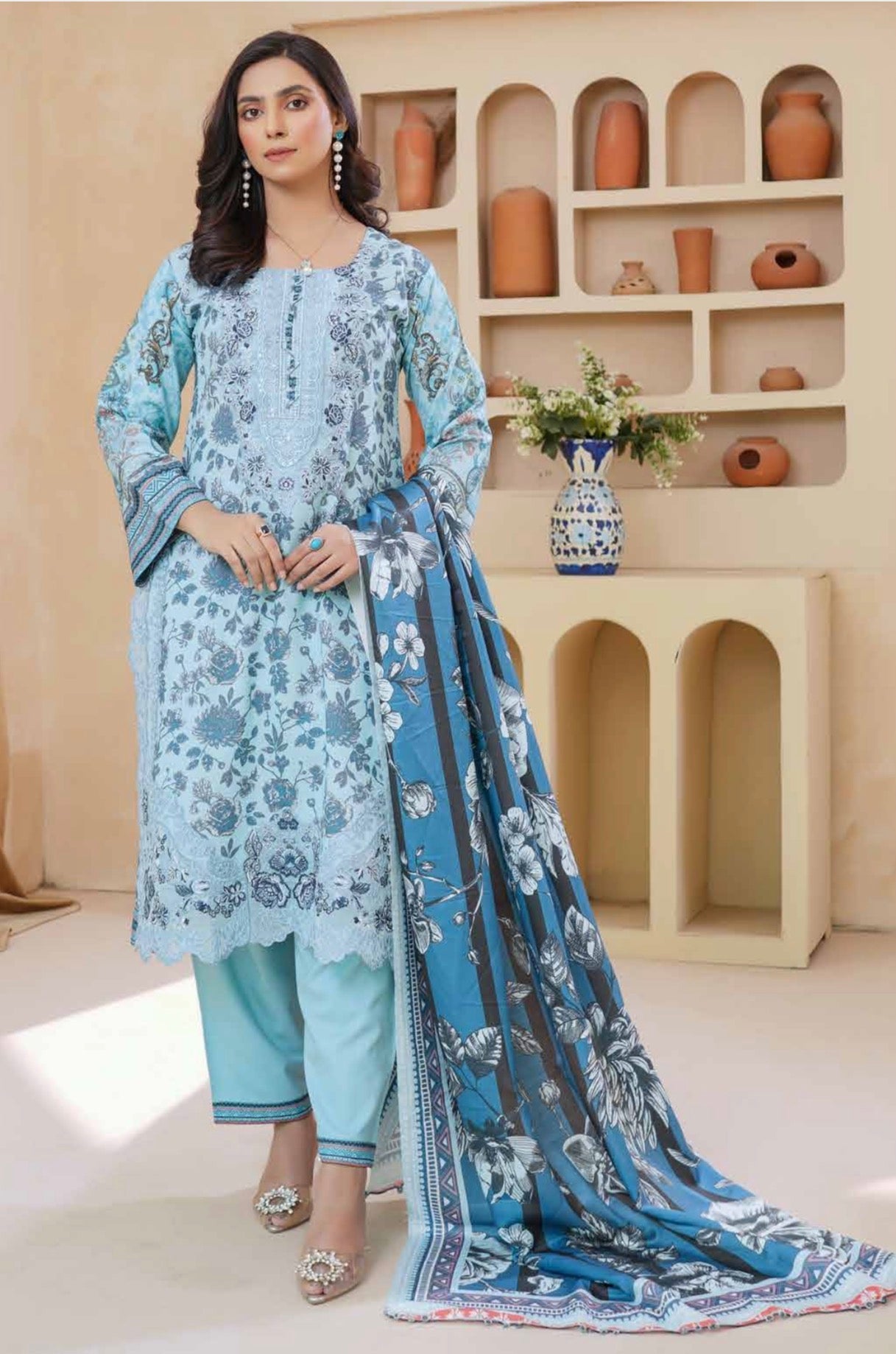 Traditional Pakistani Salwar Kameez for women, featuring intricate embroidery and vibrant fabric in a cultural wear design.