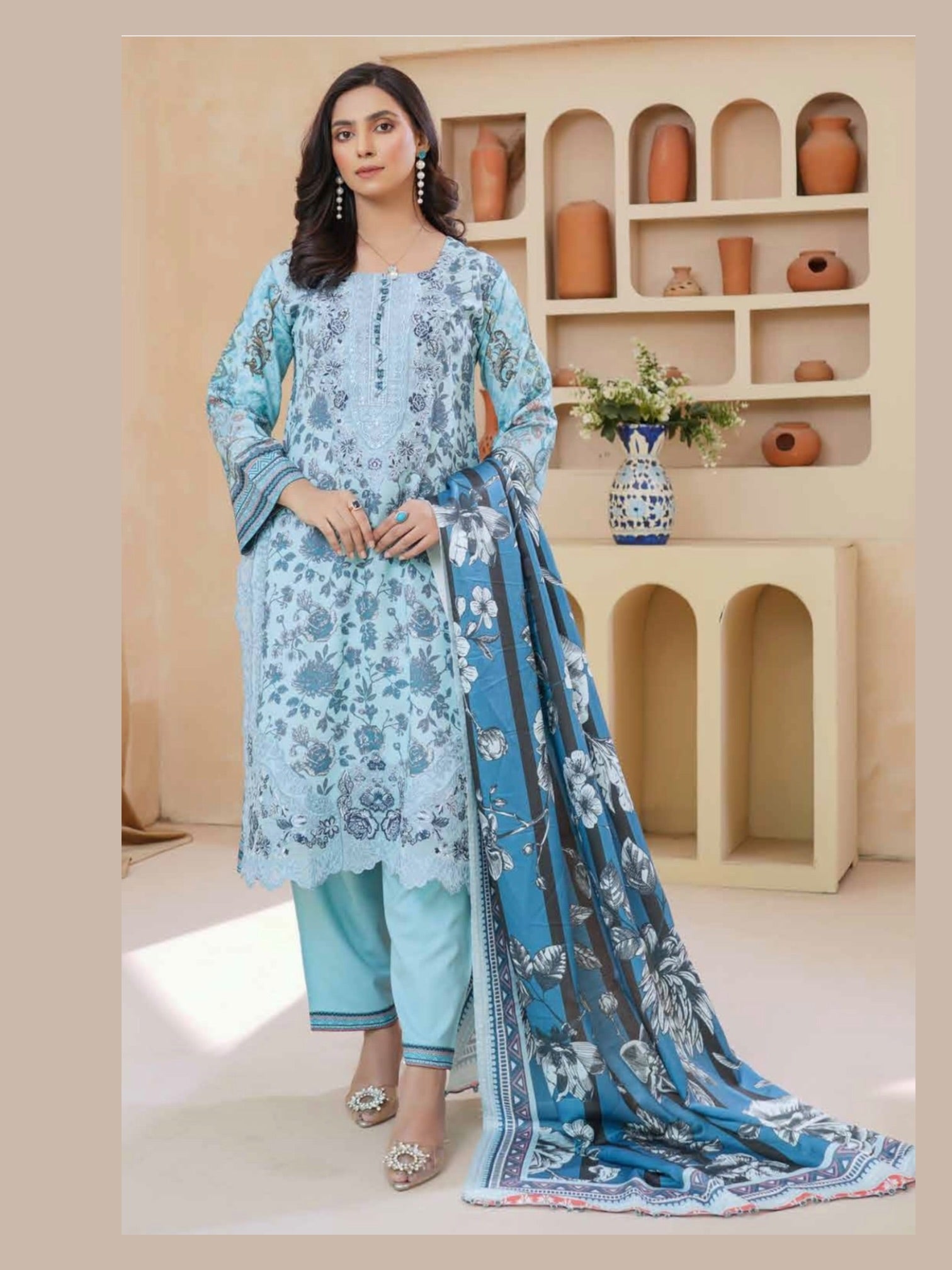 Traditional Pakistani Salwar Kameez for women with intricate embroidery, vibrant colors, and flowing fabric by Saree Ghor Charlotte.