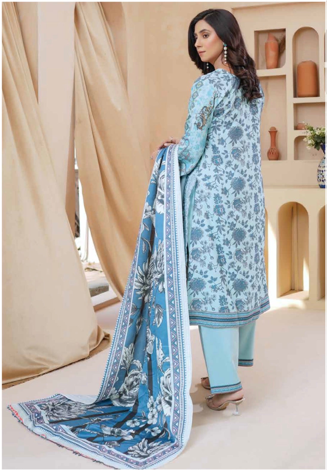 Traditional Pakistani Salwar Kameez for women, featuring vibrant fabric and intricate embroidery, by Saree Ghor Charlotte.