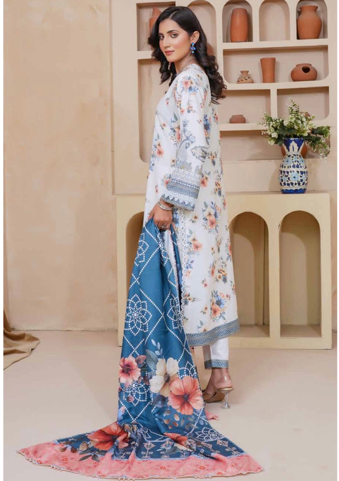 Traditional Pakistani Salwar Kameez for women, featuring vibrant fabric and intricate embroidery by Saree Ghor Charlotte.