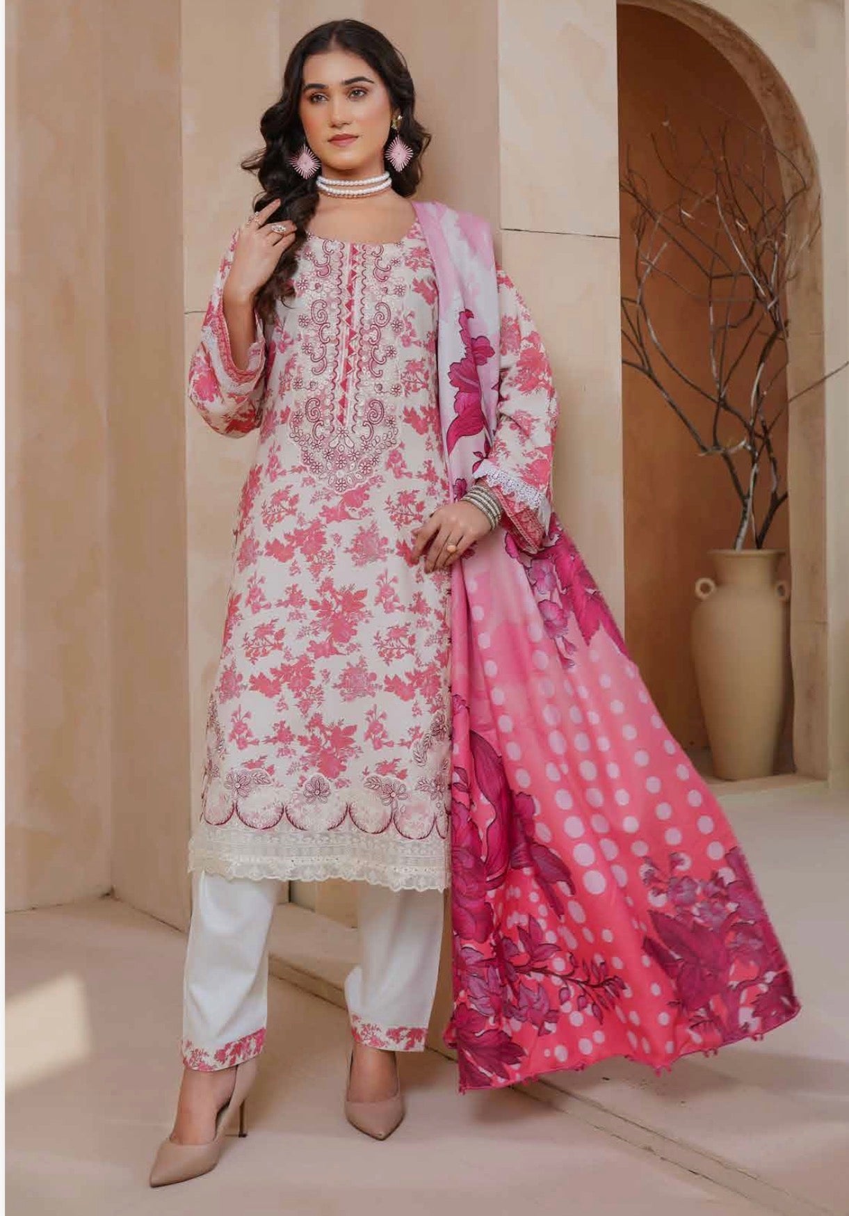 Traditional Pakistani Salwar Kameez from Saree Ghor Charlotte, featuring vibrant fabric and intricate embroidery for women.
