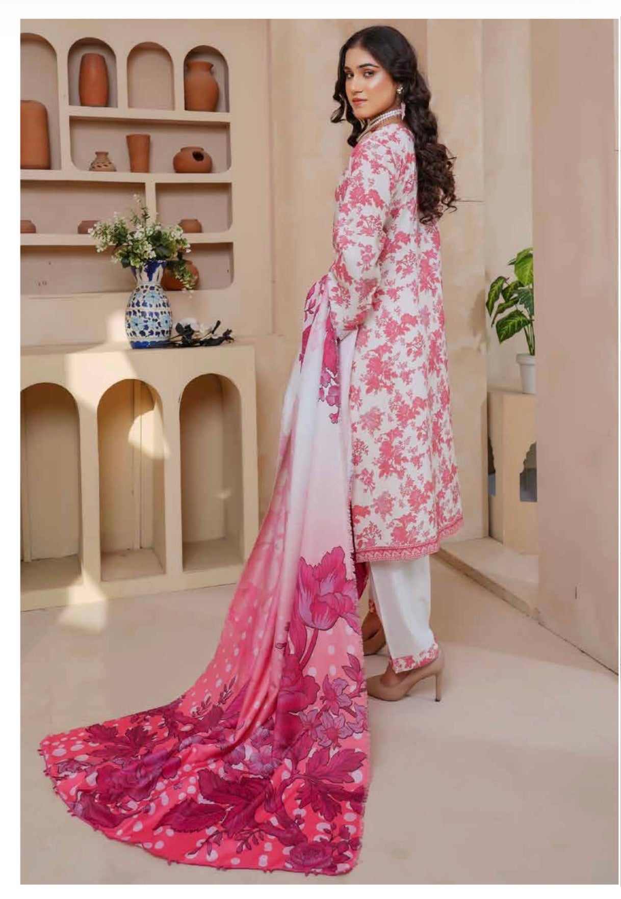 Traditional Pakistani Salwar Kameez for women by Saree Ghor Charlotte, featuring intricate embroidery and vibrant fabric.