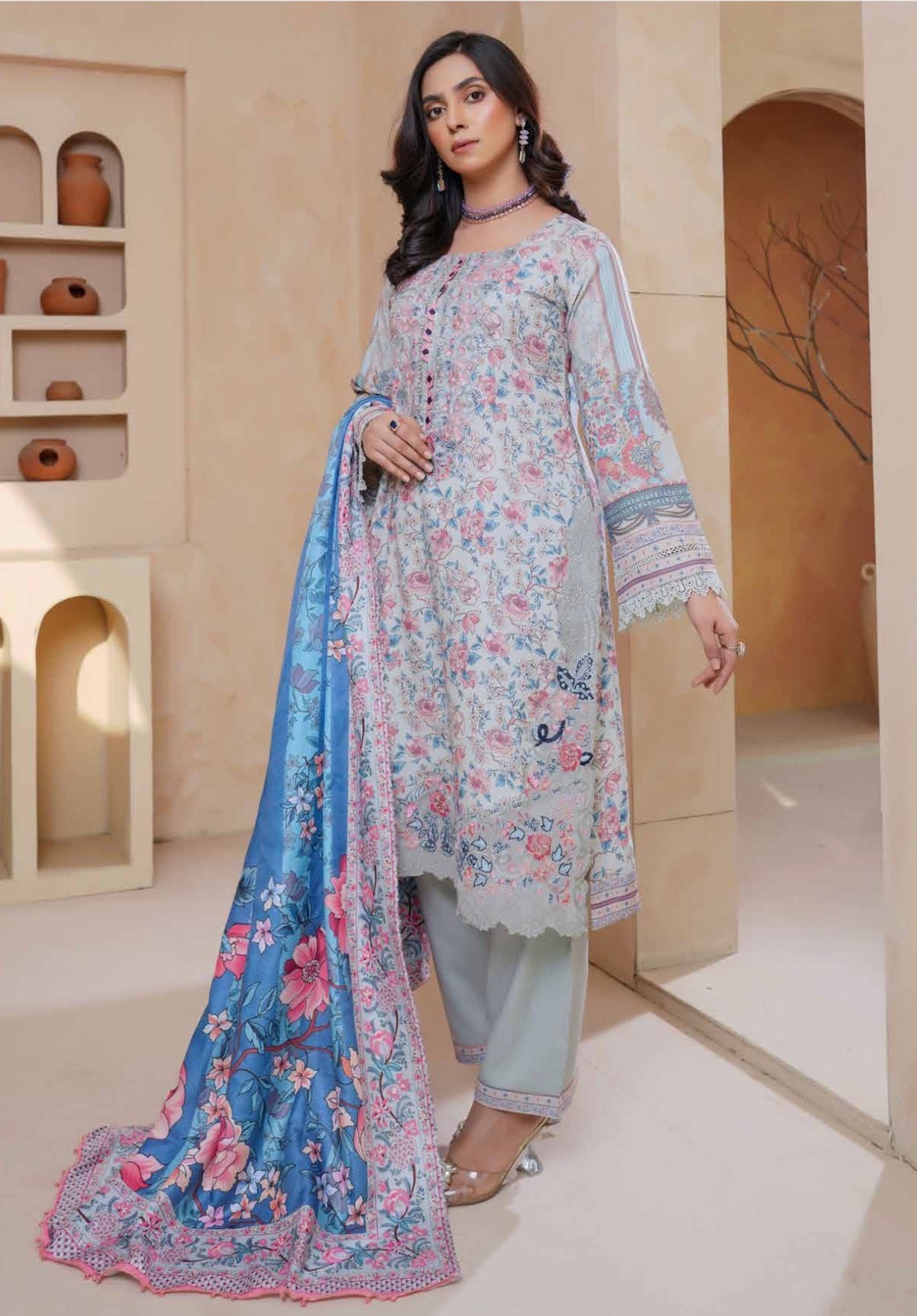Traditional Pakistani Salwar Kameez for women, featuring vibrant fabric and intricate embroidery from Saree Ghor Charlotte.