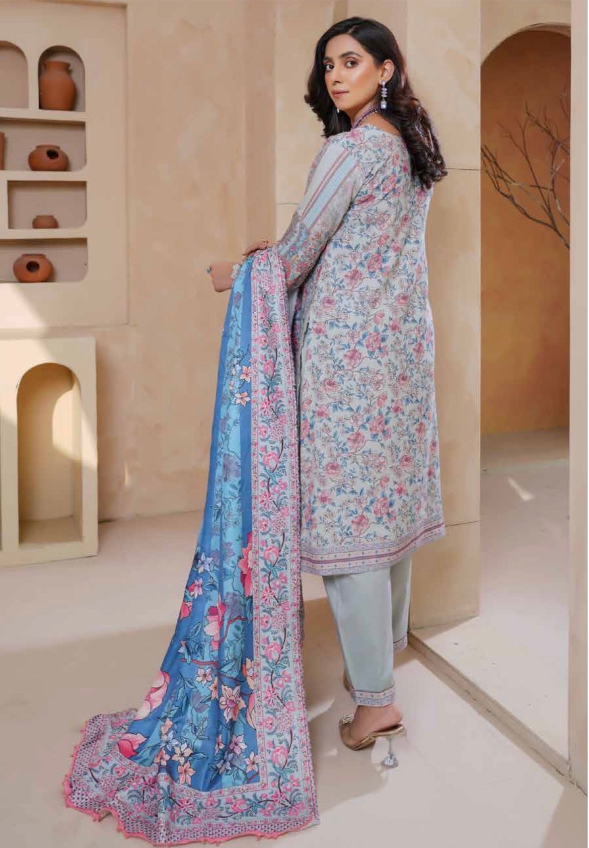 Traditional Pakistani Salwar Kameez for women, featuring vibrant fabric and intricate embroidery, by Saree Ghor Charlotte.