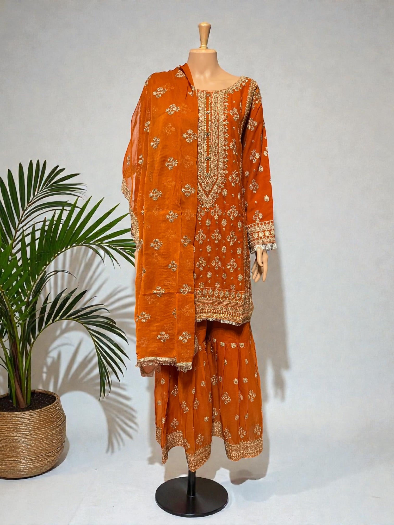 Traditional Salwar Kameez for women in vibrant colors, featuring intricate embroidery and a matching dupatta from Saree Ghor Charlotte.
