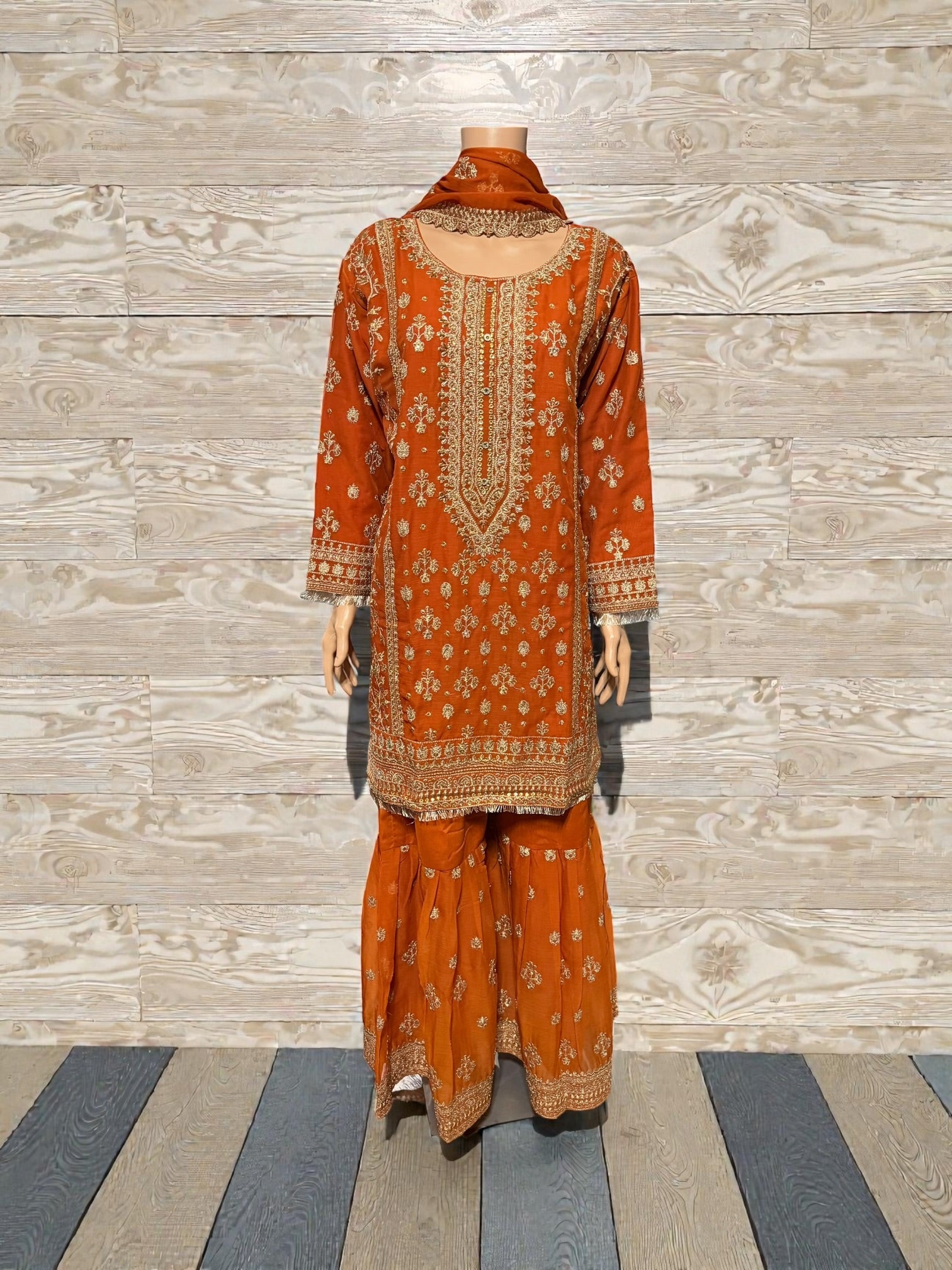 Traditional Salwar Kameez for women by Saree Ghor Charlotte, showcasing intricate embroidery and vibrant cultural attire.