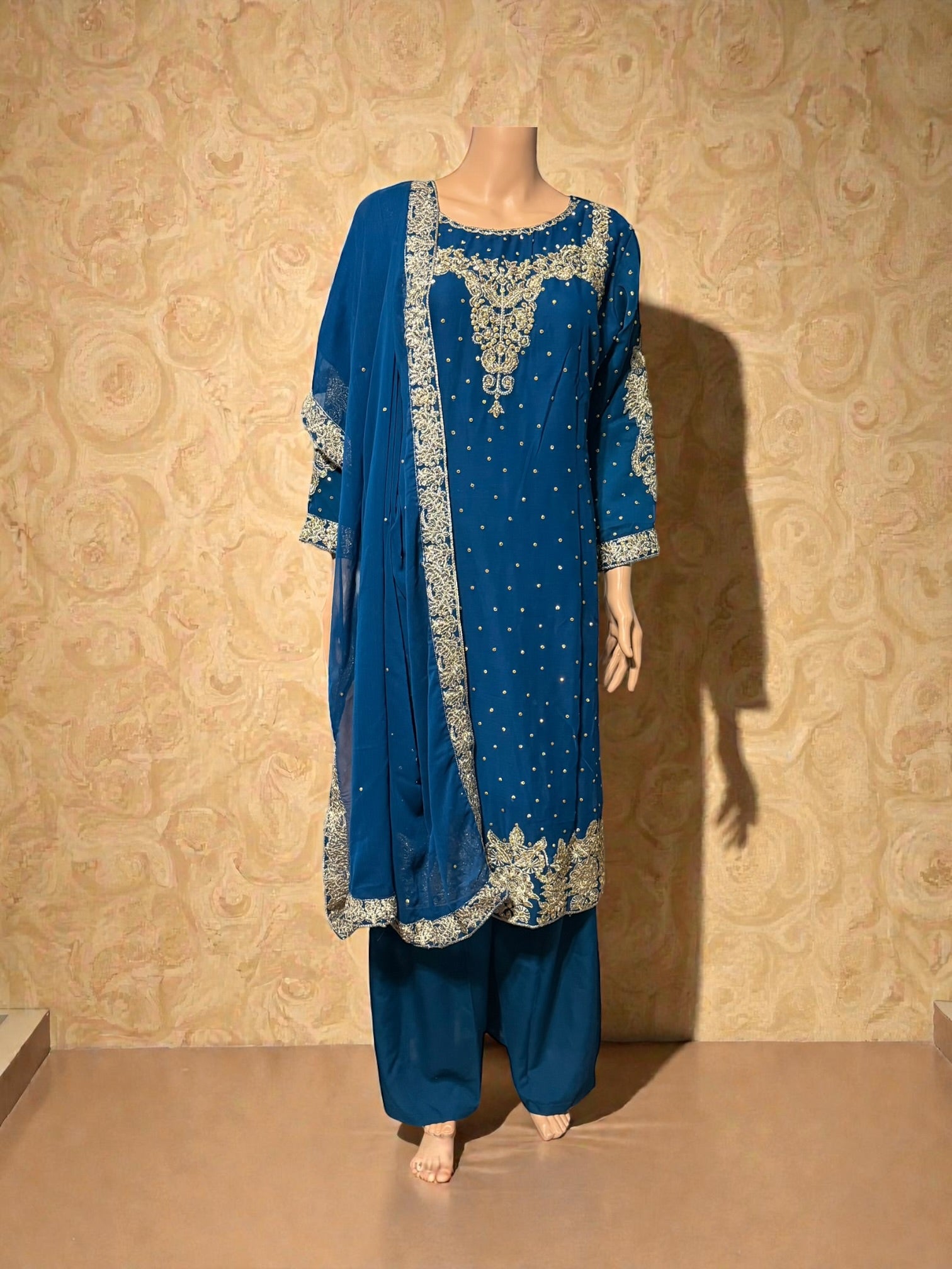 Traditional Salwar Kameez for women by Saree Ghor Charlotte, featuring intricate embroidery and vibrant cultural design.