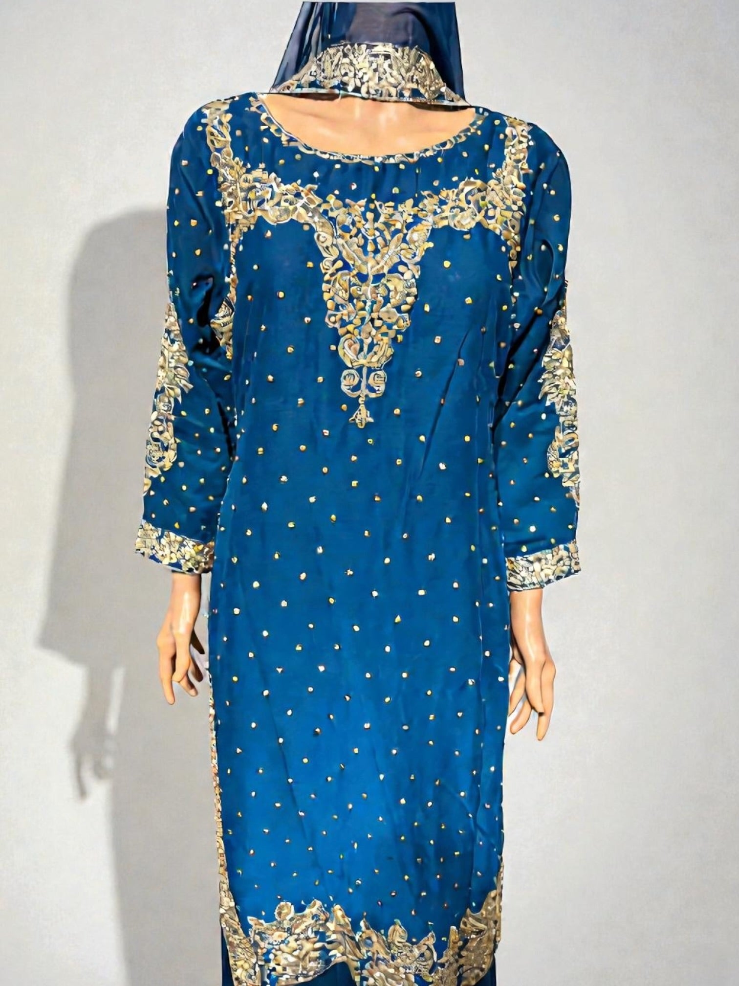 Traditional Salwar Kameez for women from Saree Ghor Charlotte, featuring intricate embroidery in vibrant colors.