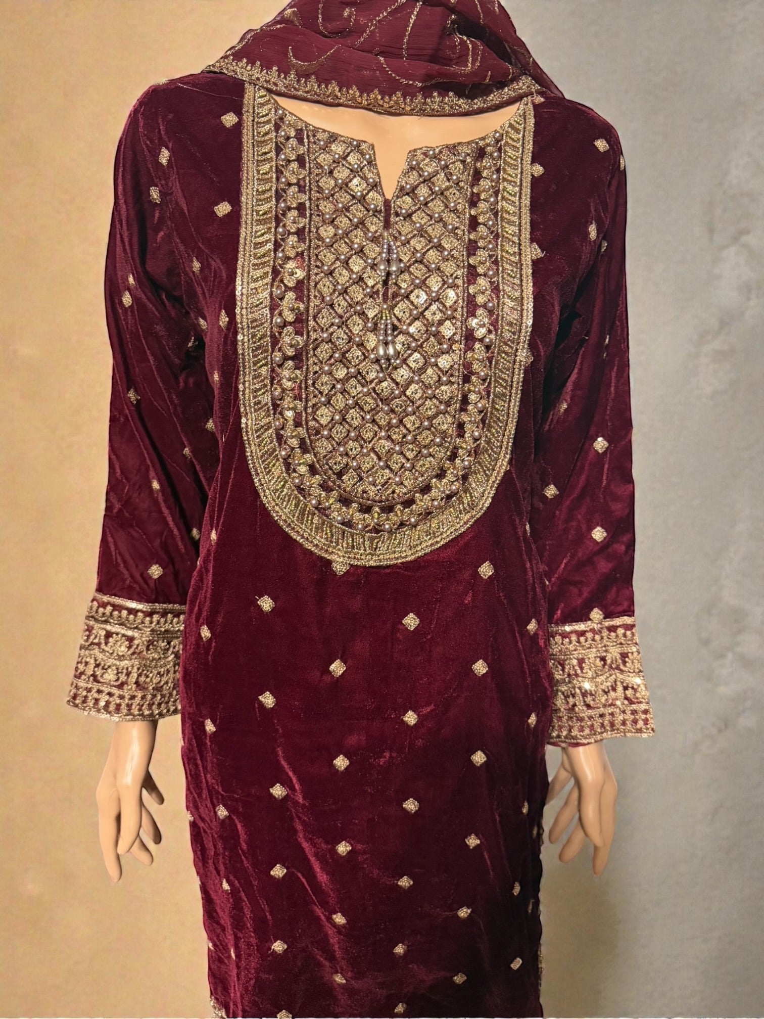 Traditional Salwar Kameez for women by Saree Ghor Charlotte, showing vibrant fabric and intricate embroidery details.