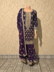 Traditional Salwar Kameez for women by Saree Ghor Charlotte, featuring vibrant fabric and intricate embroidery.