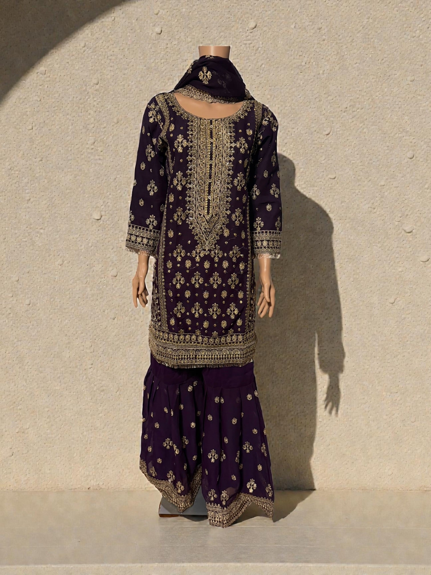 Traditional Salwar Kameez for women by Saree Ghor Charlotte, featuring vibrant fabric and intricate embroidery.