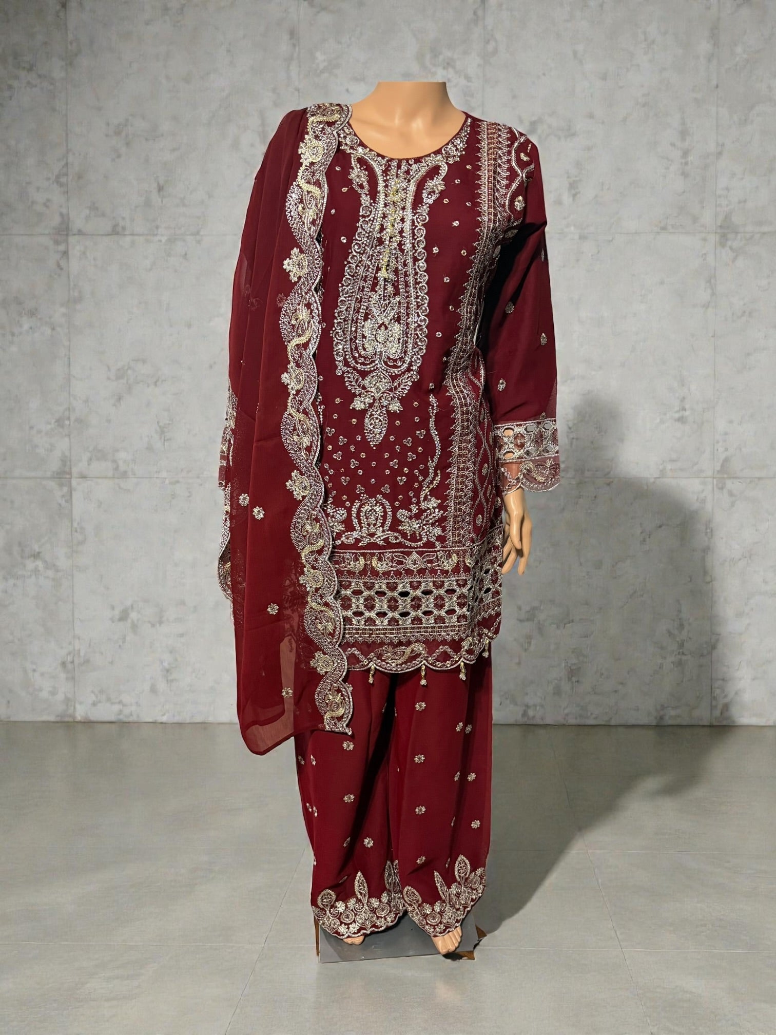 Traditional Salwar Kameez for women by Saree Ghor Charlotte, featuring intricate embroidery and vibrant cultural design.
