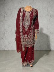 Traditional Salwar Kameez for women by Saree Ghor Charlotte, featuring intricate embroidery and vibrant cultural design.