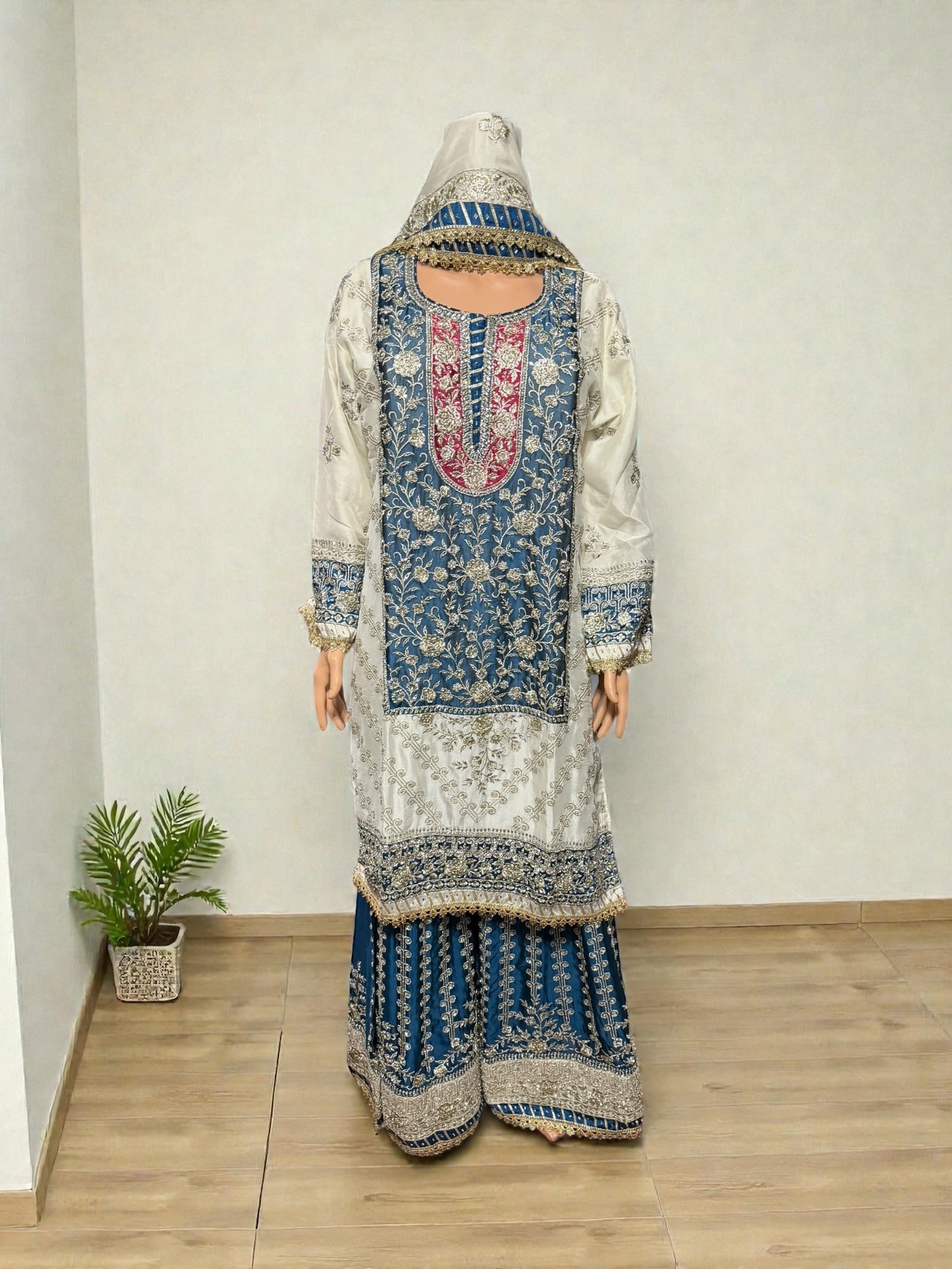 Elegant Rangoli Russian Plazo dress by Saree Ghor Charlotte, a traditional women’s salwar kameez with vibrant cultural design.