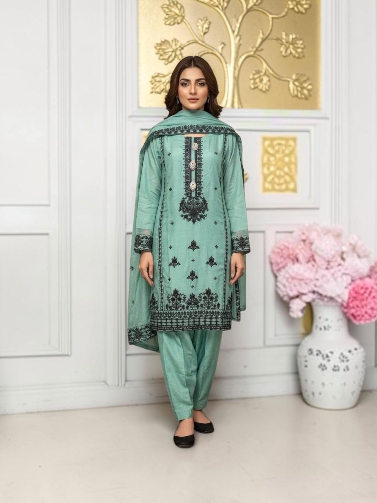 Elegant designer party wear Salwar Kameez set by Saree Ghor Charlotte, featuring intricate embroidery and vibrant fabric for women.